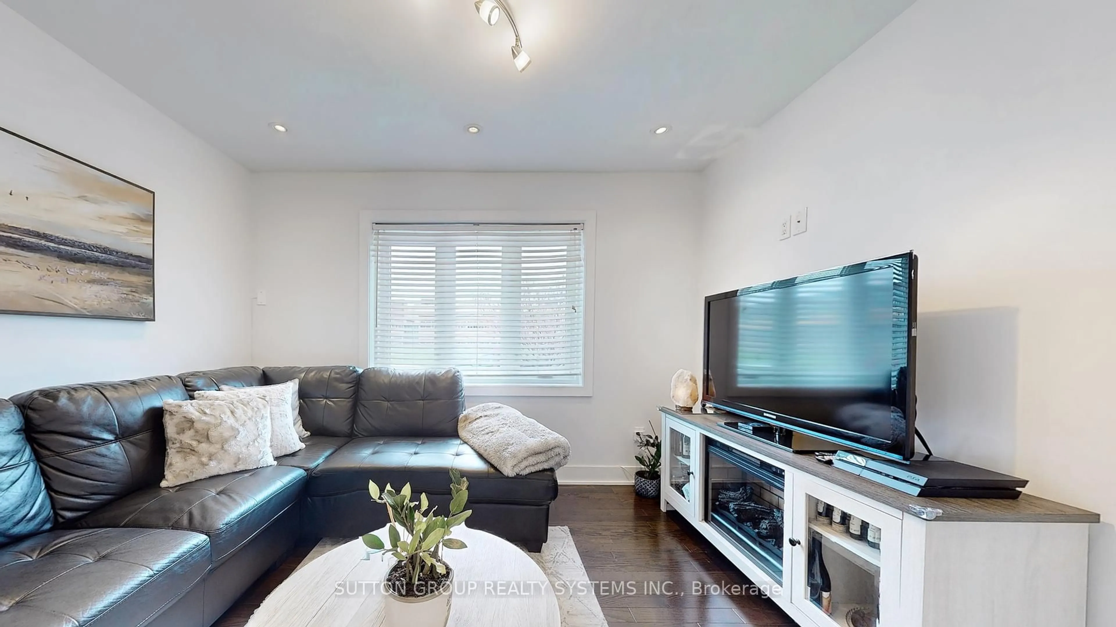 Living room with furniture, wood/laminate floor for 48 Bicknell Ave, Toronto Ontario M6M 4G5