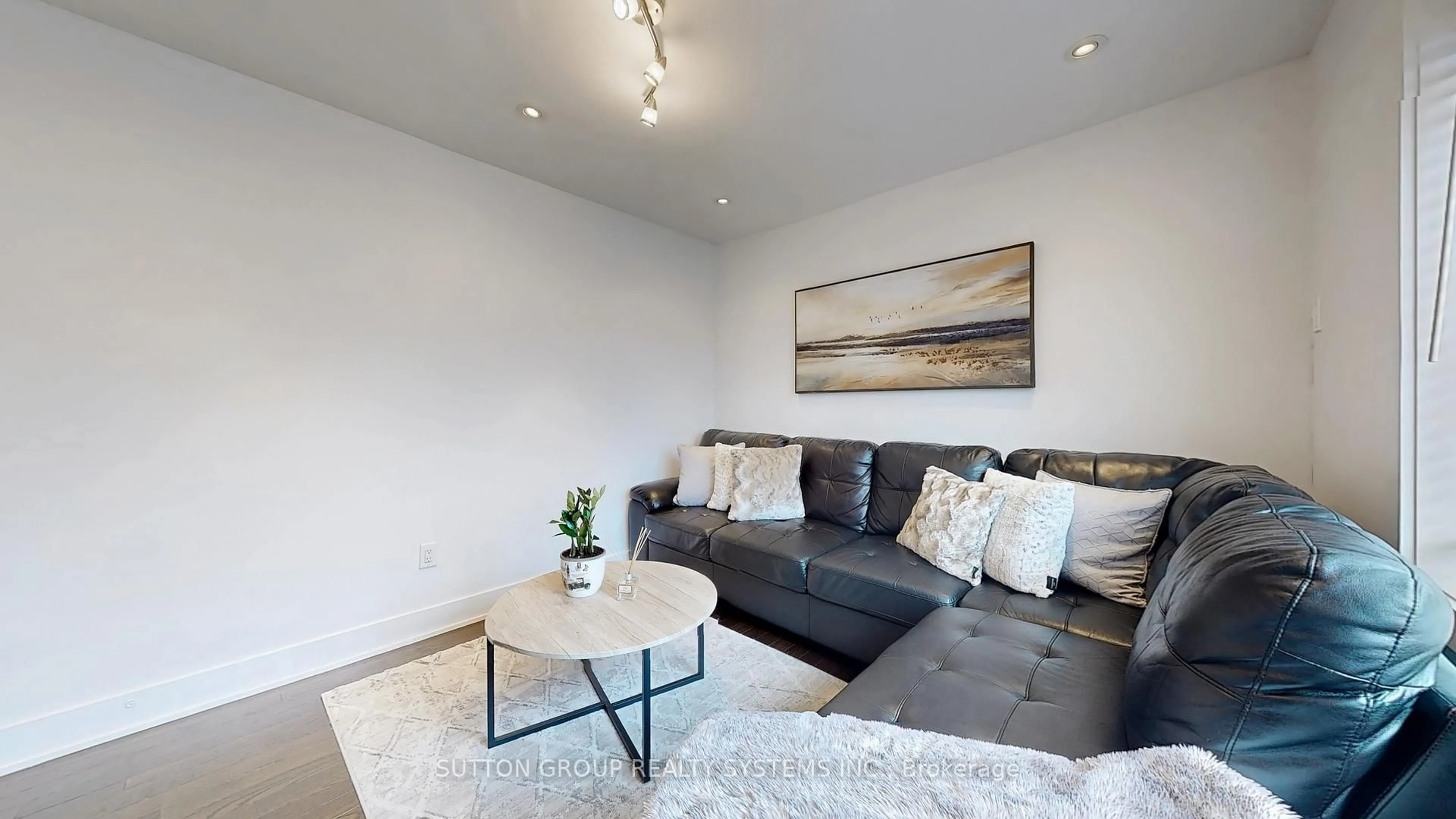 Living room with furniture, wood/laminate floor for 48 Bicknell Ave, Toronto Ontario M6M 4G5