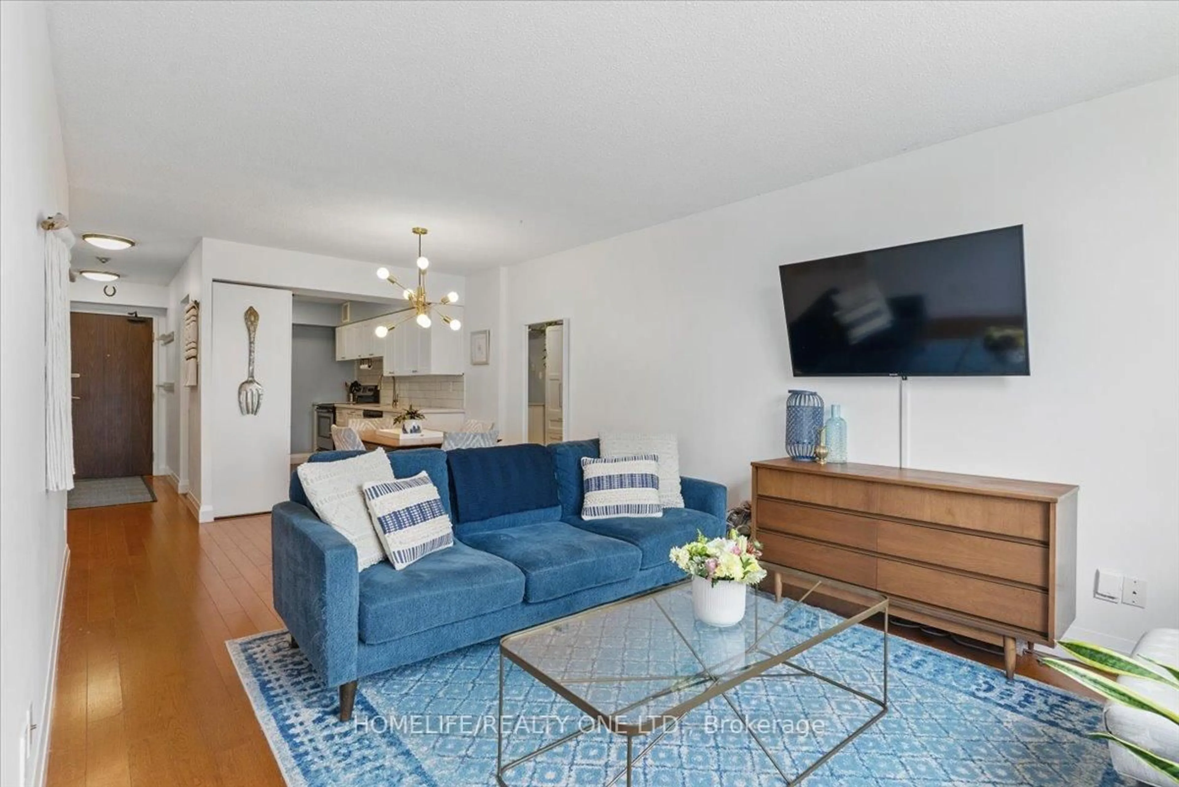 Living room with furniture, unknown for 1485 Lakeshore Rd #218, Mississauga Ontario L5E 3G2