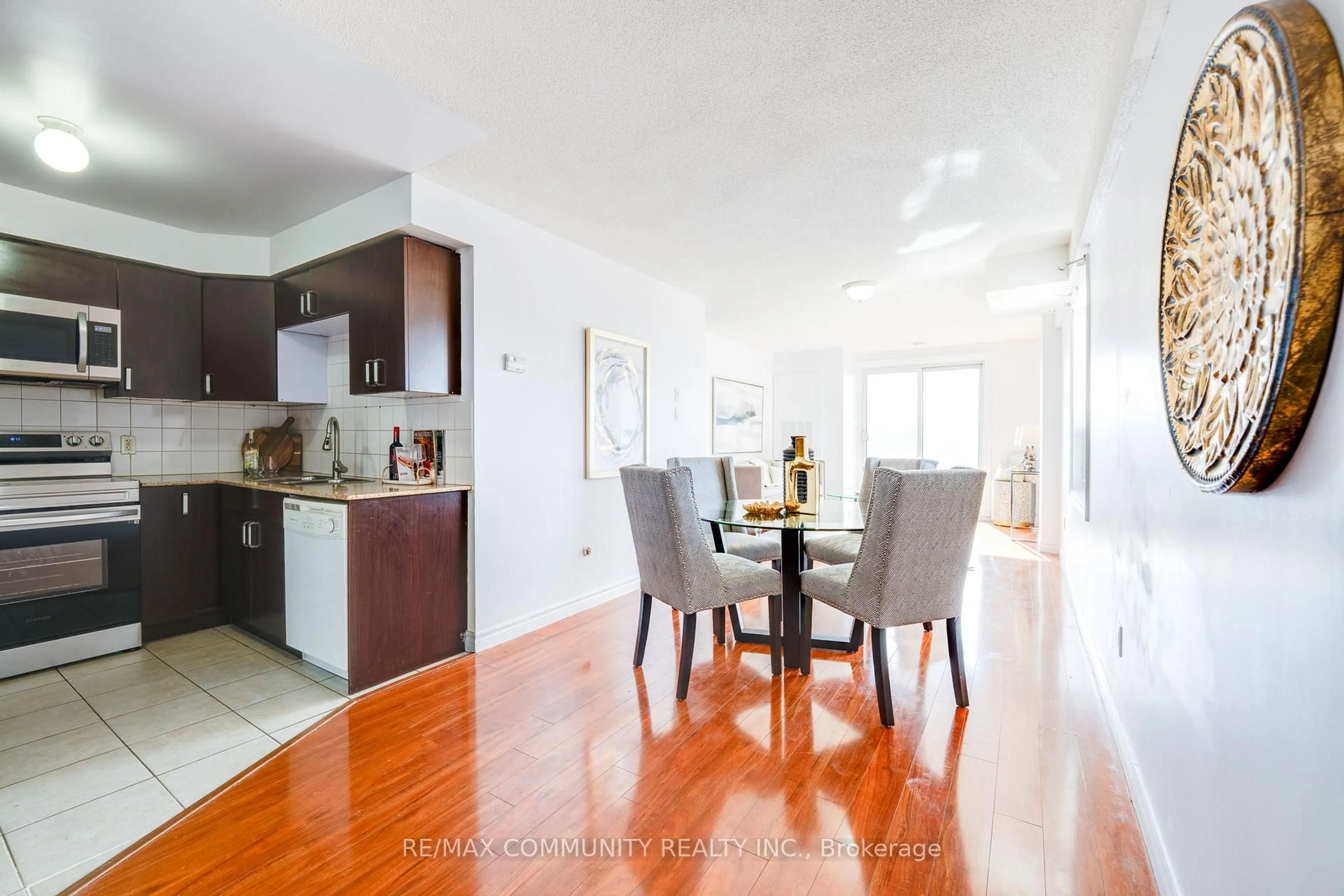 Dining room, wood/laminate floor for 7405 Goreway Dr #415, Mississauga Ontario L4T 0A3
