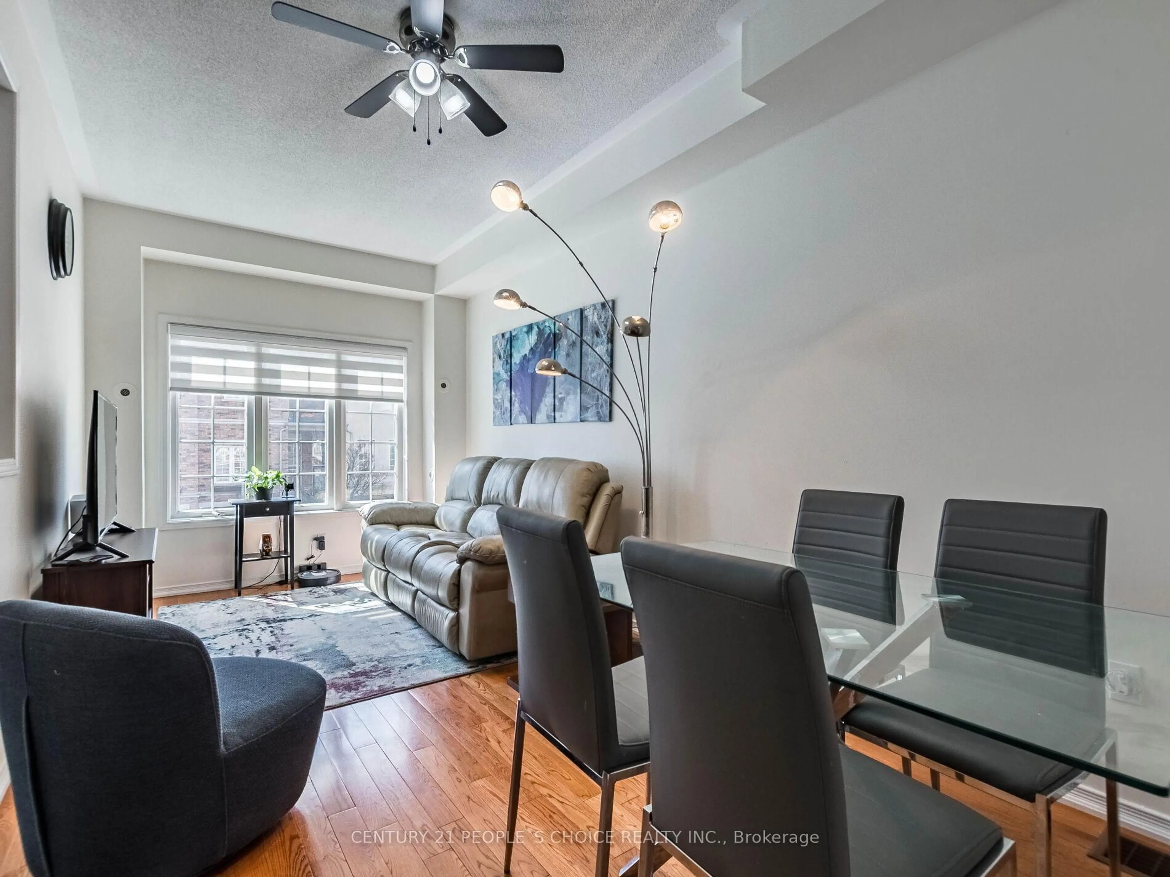 Living room with furniture, wood/laminate floor for 435 Hensall Circ #29, Mississauga Ontario L5A 4P1