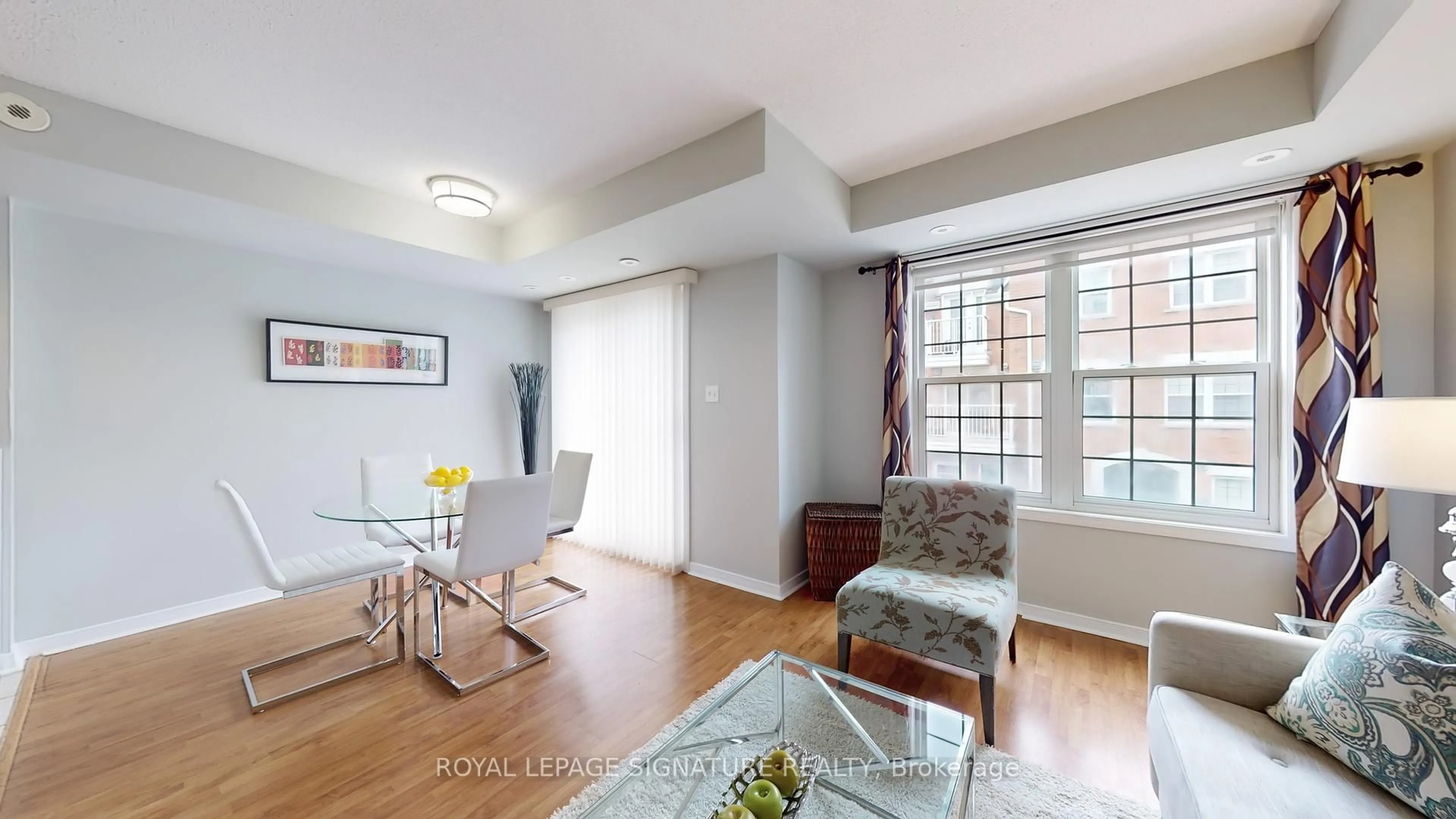 Living room with furniture, wood/laminate floor for 37 Four Winds Dr #63, Toronto Ontario M3J 1K7