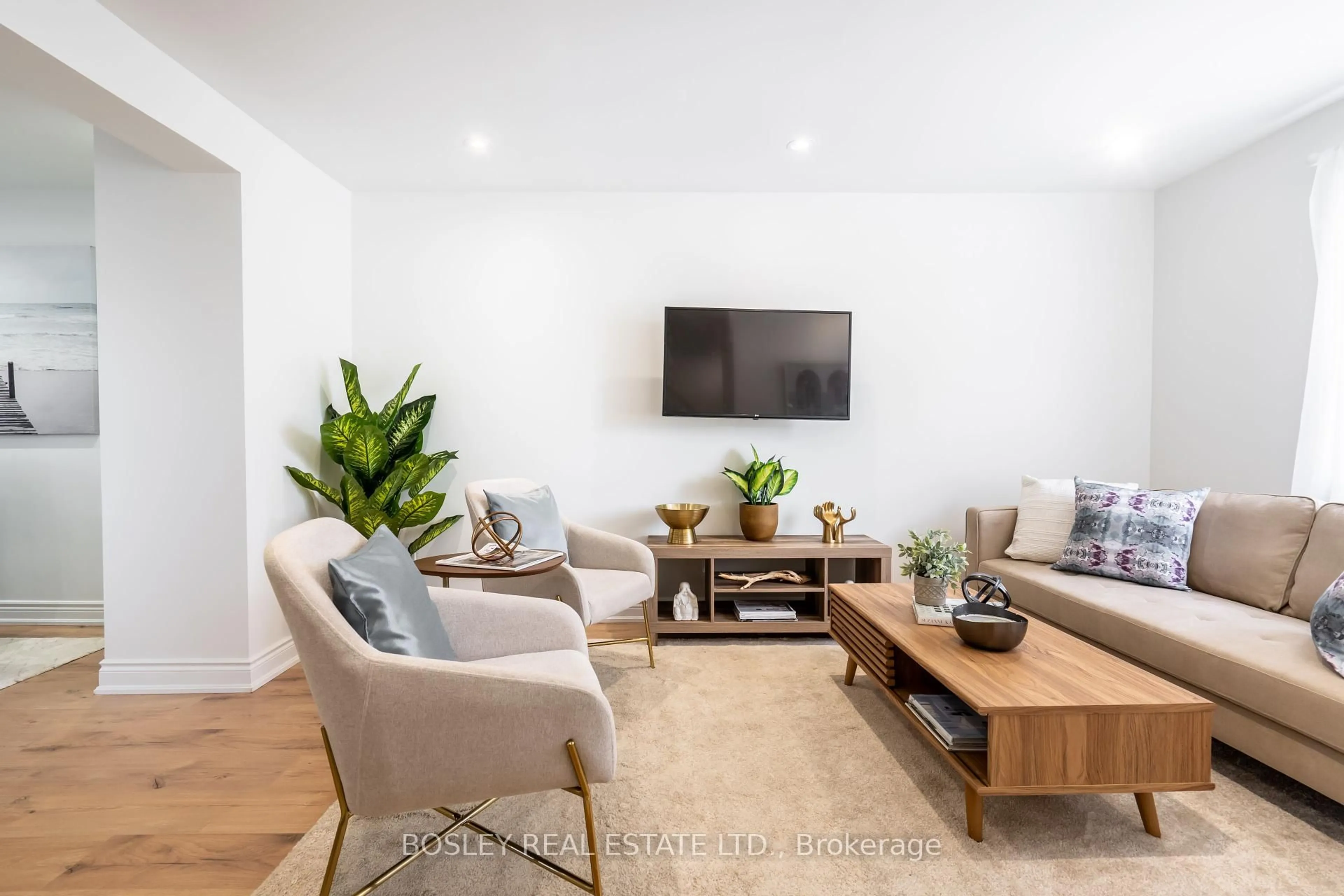 Living room with furniture, wood/laminate floor for 104 Aileen Ave, Toronto Ontario M6M 1E9