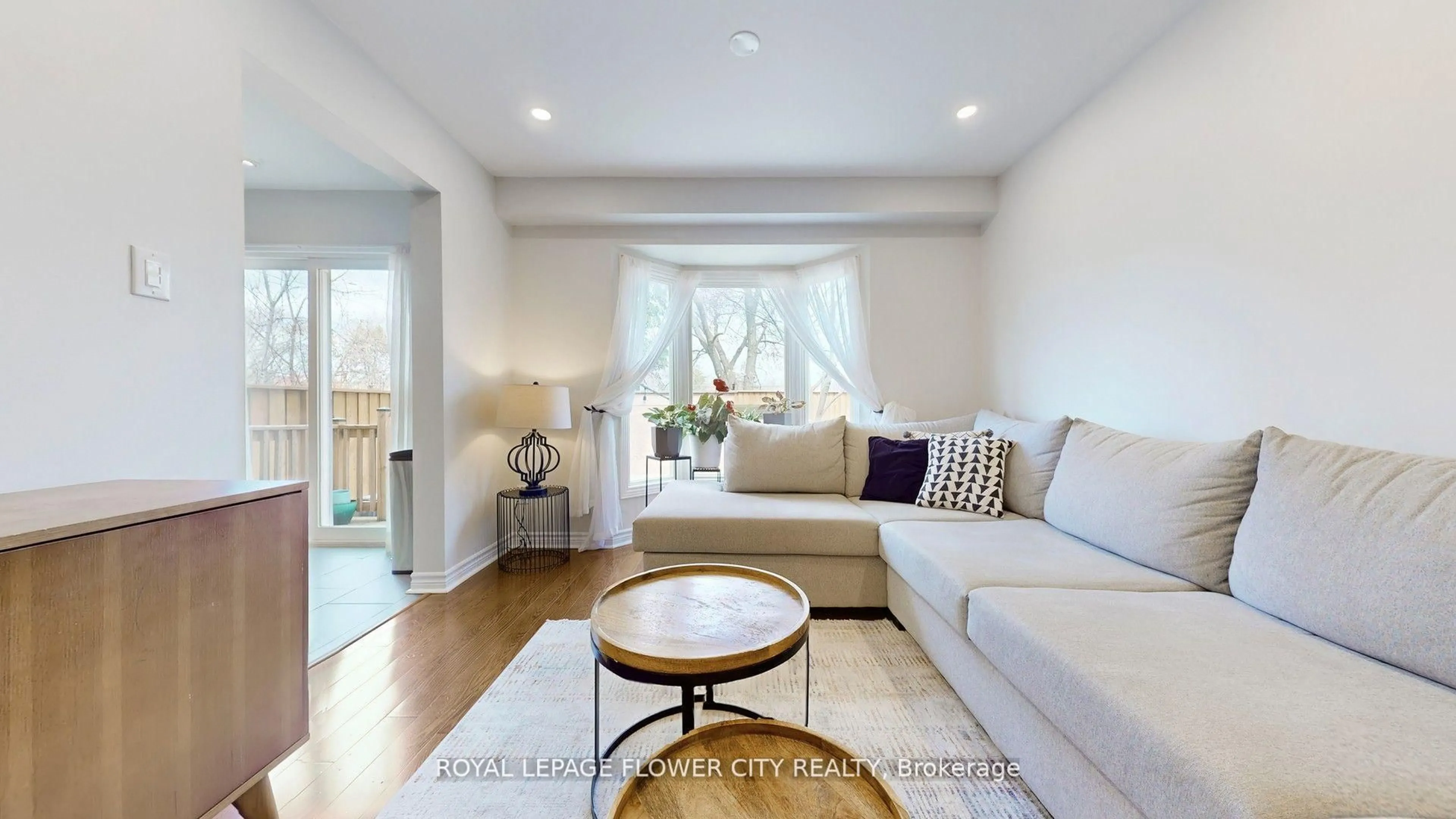 Living room with furniture, wood/laminate floor for 2355 Fifth Line #30, Mississauga Ontario L5K 2M8