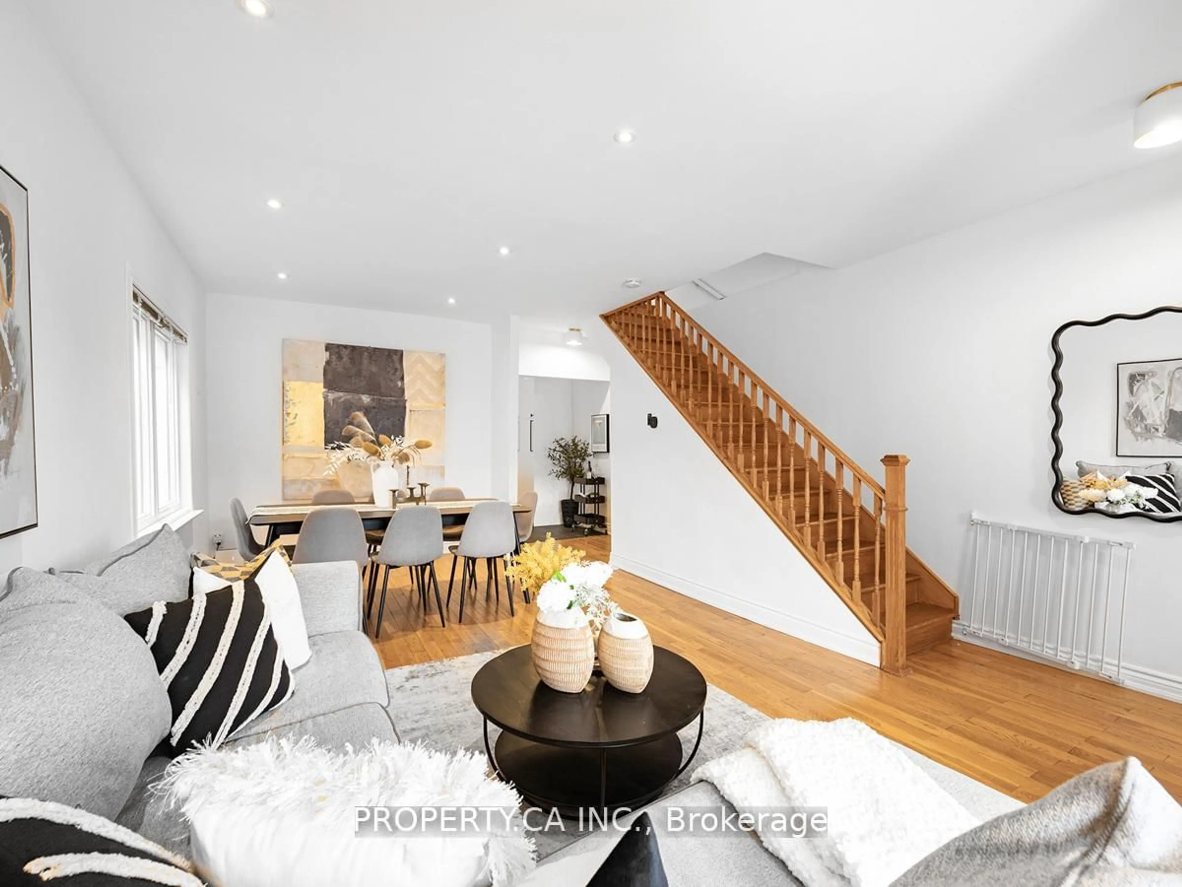 Living room with furniture, wood/laminate floor for 29 Gilbert Ave, Toronto Ontario M6E 4W2