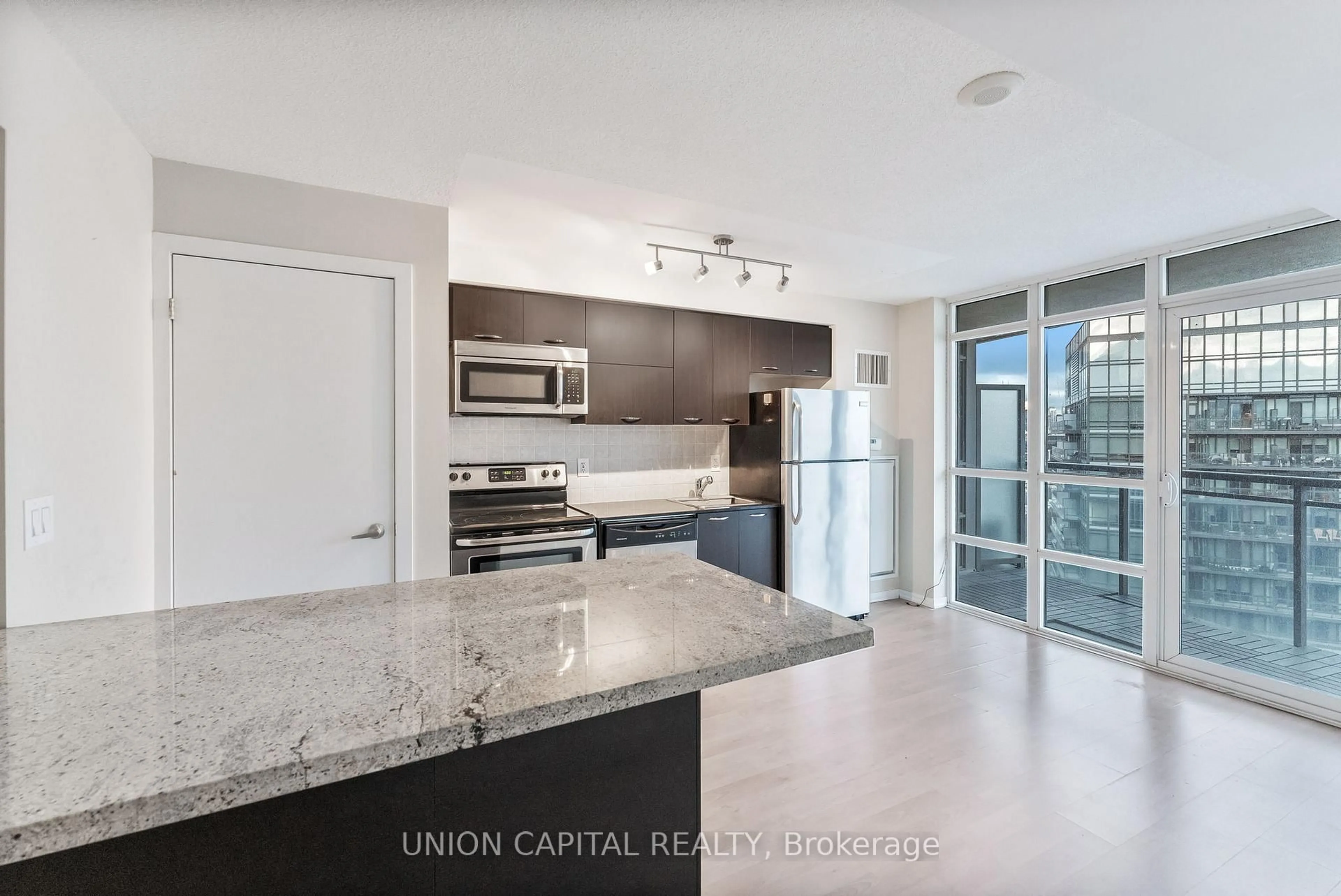 Open concept kitchen, unknown for 38 Joe Shuster Way #1801, Toronto Ontario M6K 0A5
