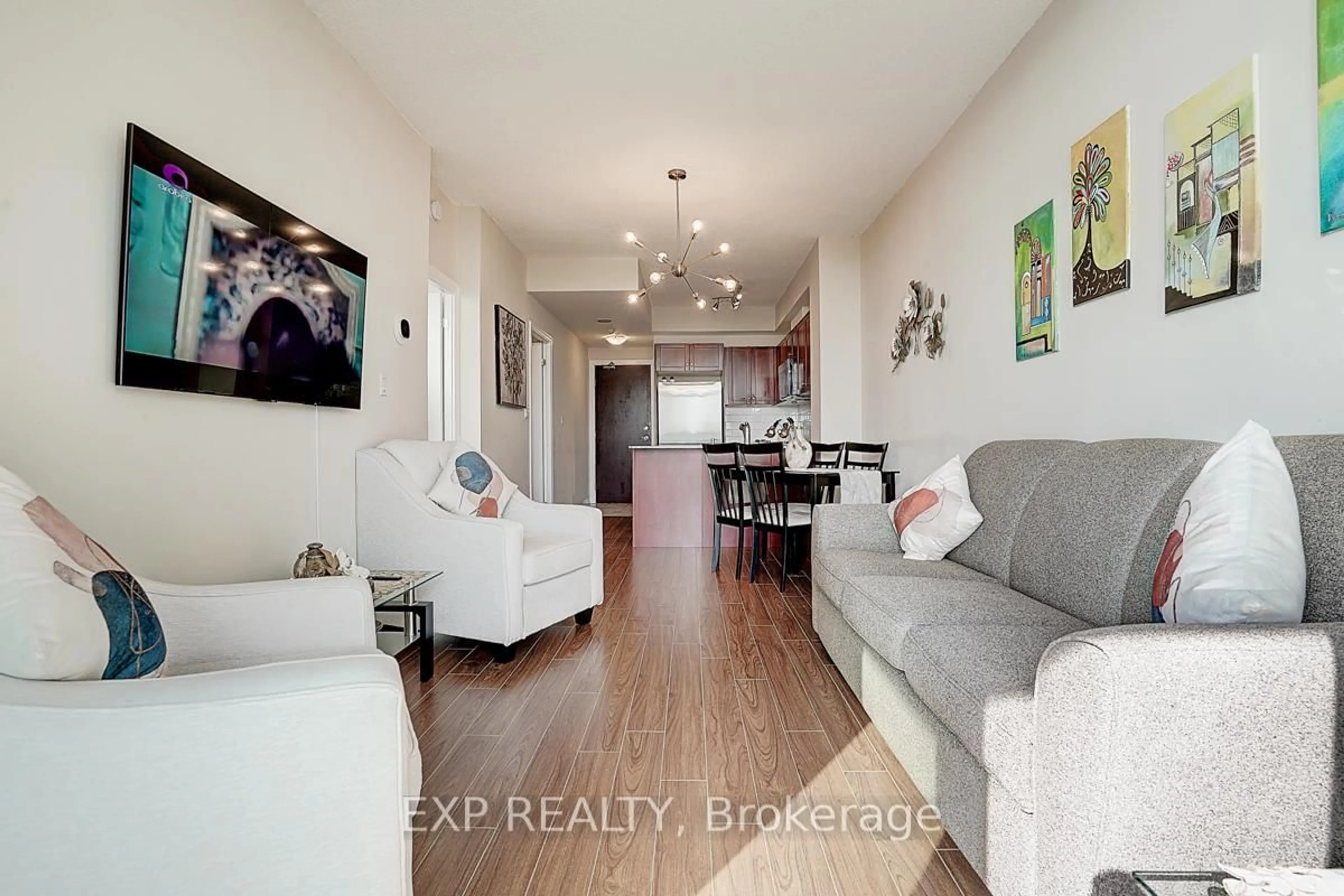 Living room with furniture, wood/laminate floor for 1359 Rathburn Rd #1111, Mississauga Ontario L4W 5P7