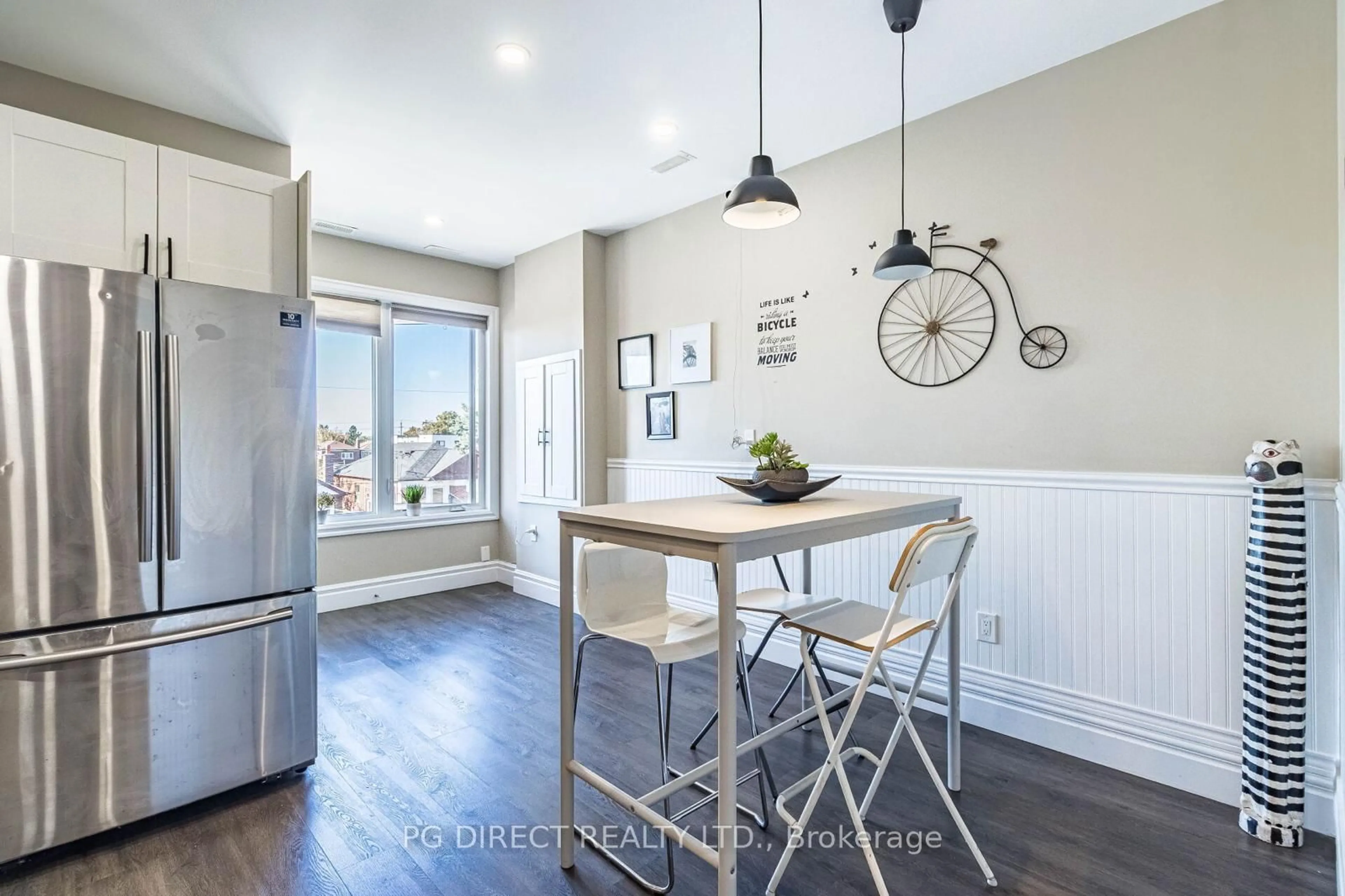 Open concept kitchen, wood/laminate floor for 17 Montcalm Ave, Toronto Ontario M6E 4N5