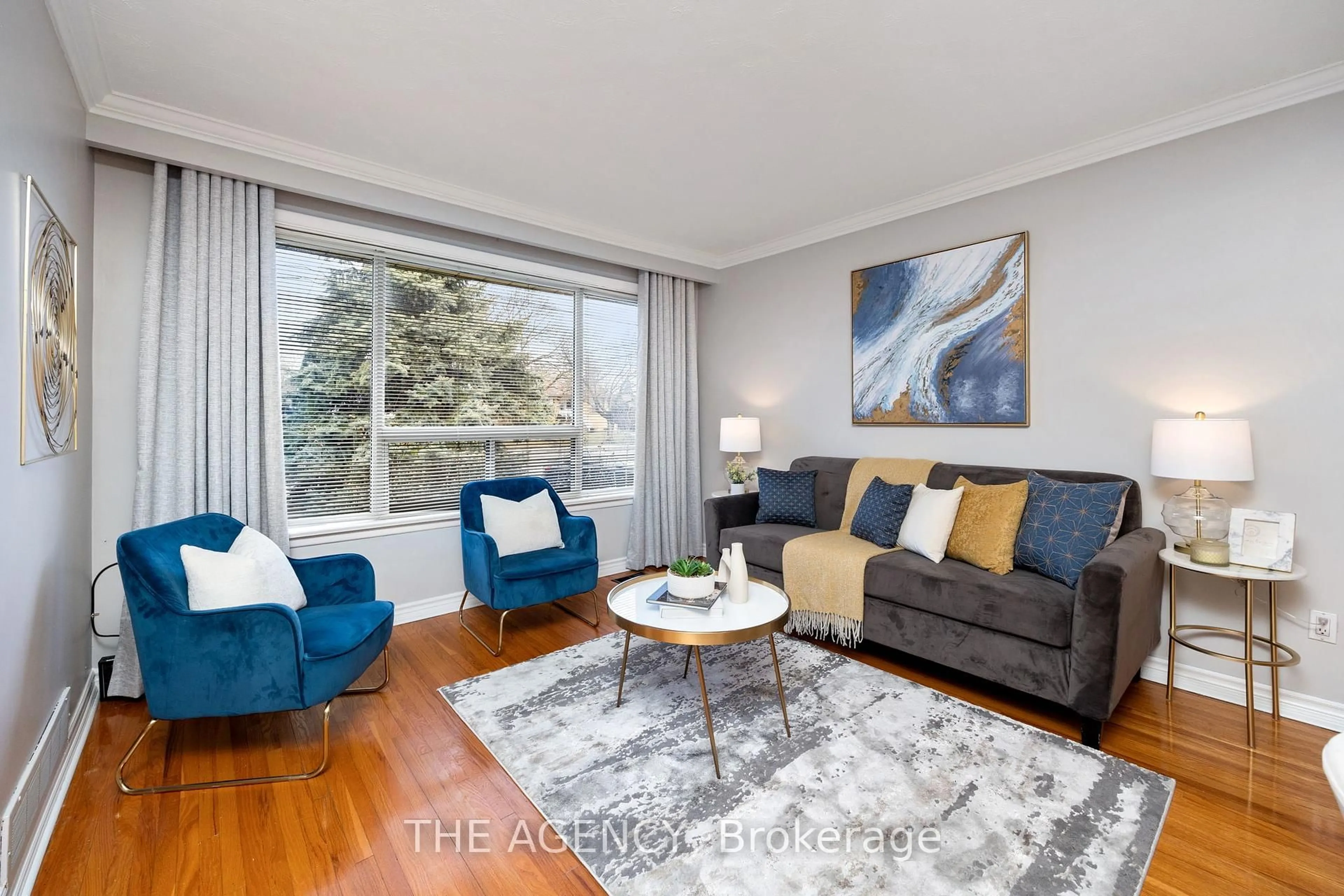 Living room with furniture, wood/laminate floor for 85 Post Rd, Brampton Ontario L6V 1X3