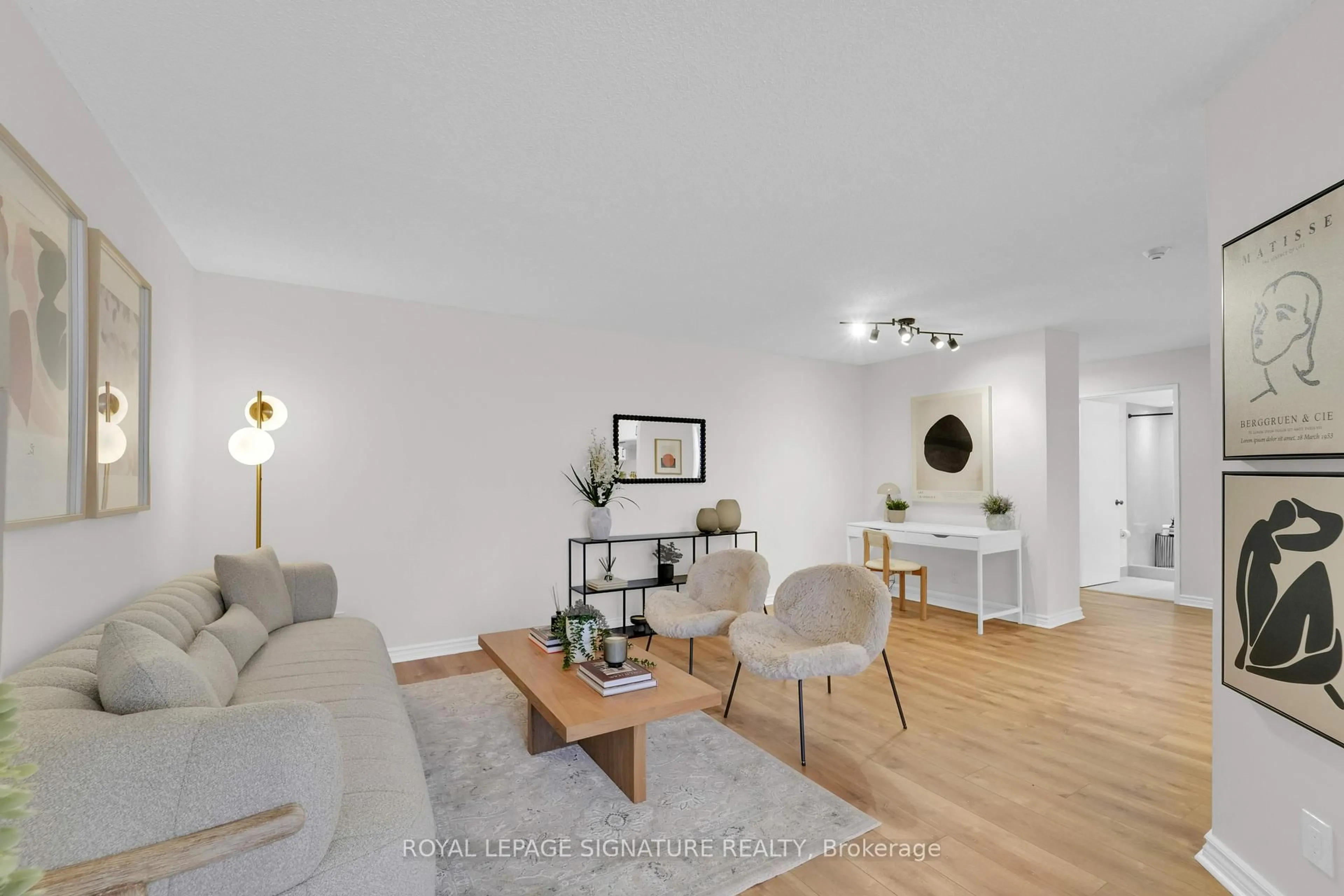 Living room with furniture, wood/laminate floor for 41 Markbrook Lane #1402, Toronto Ontario M9V 5E6
