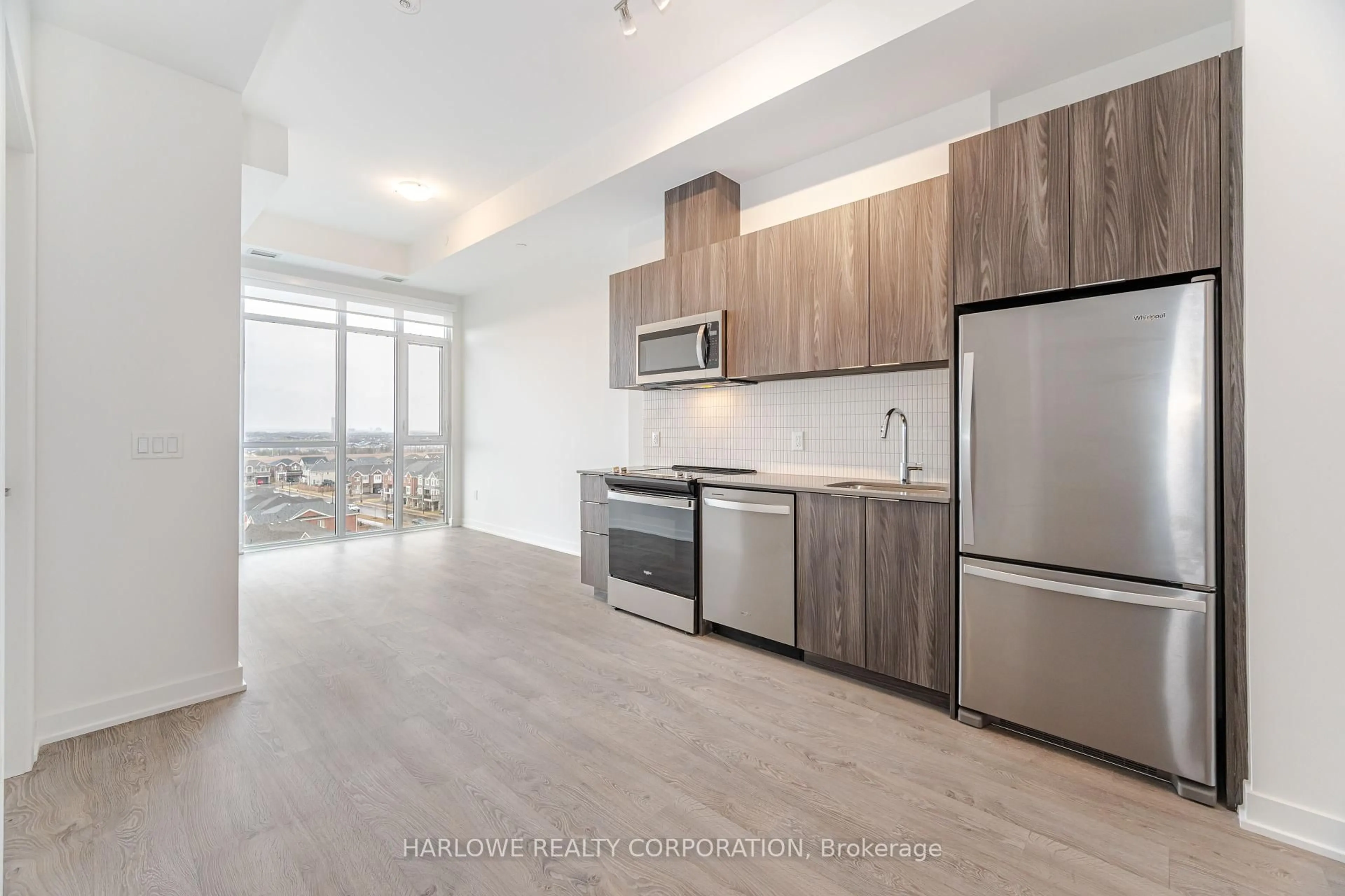 Open concept kitchen, wood/laminate floor for 770 Whitlock Ave #802, Milton Ontario L9E 1S2