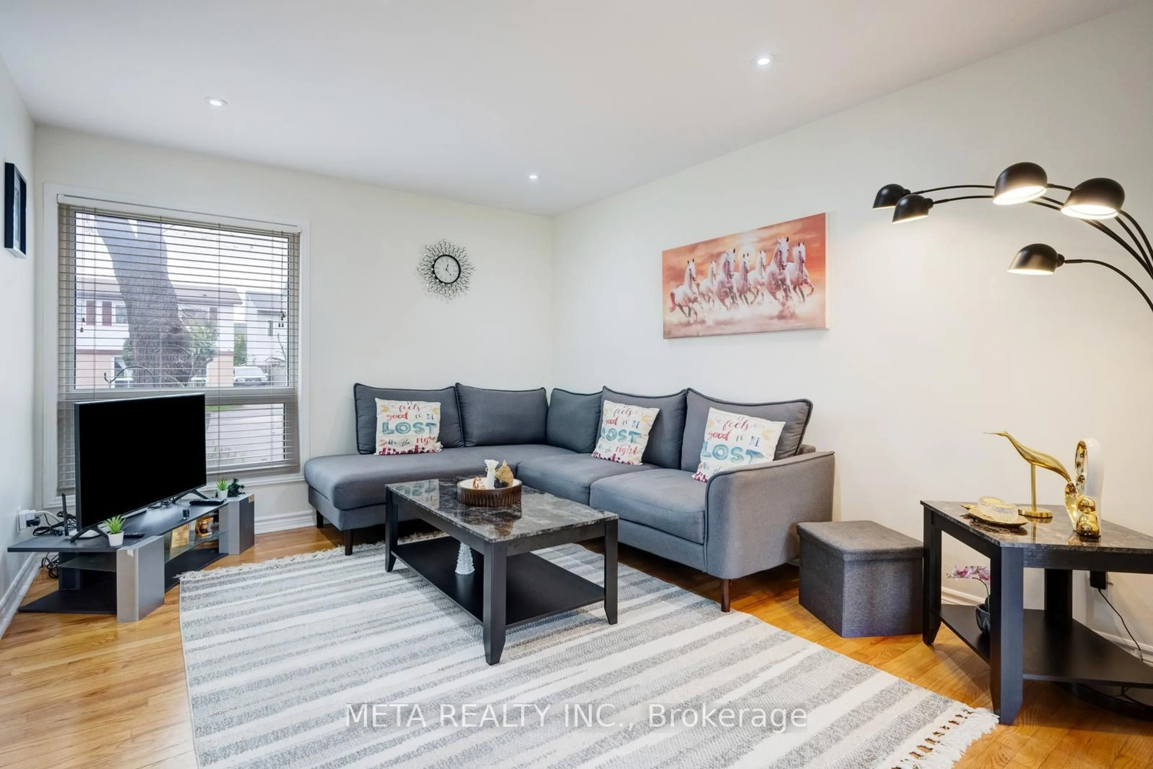 Living room with furniture, wood/laminate floor for 24 Horseshoe Crt, Brampton Ontario L6S 1S1