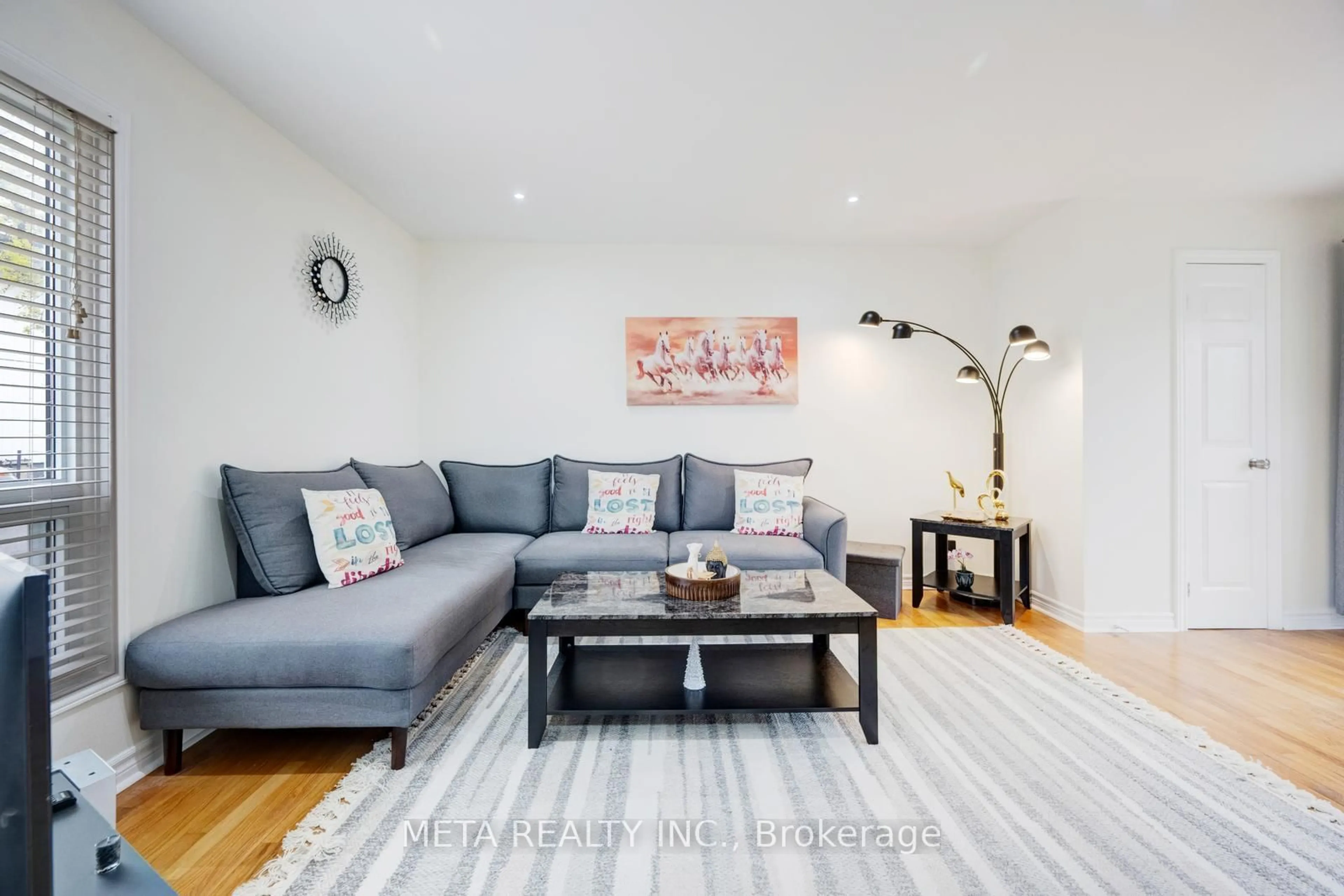Living room with furniture, wood/laminate floor for 24 Horseshoe Crt, Brampton Ontario L6S 1S1