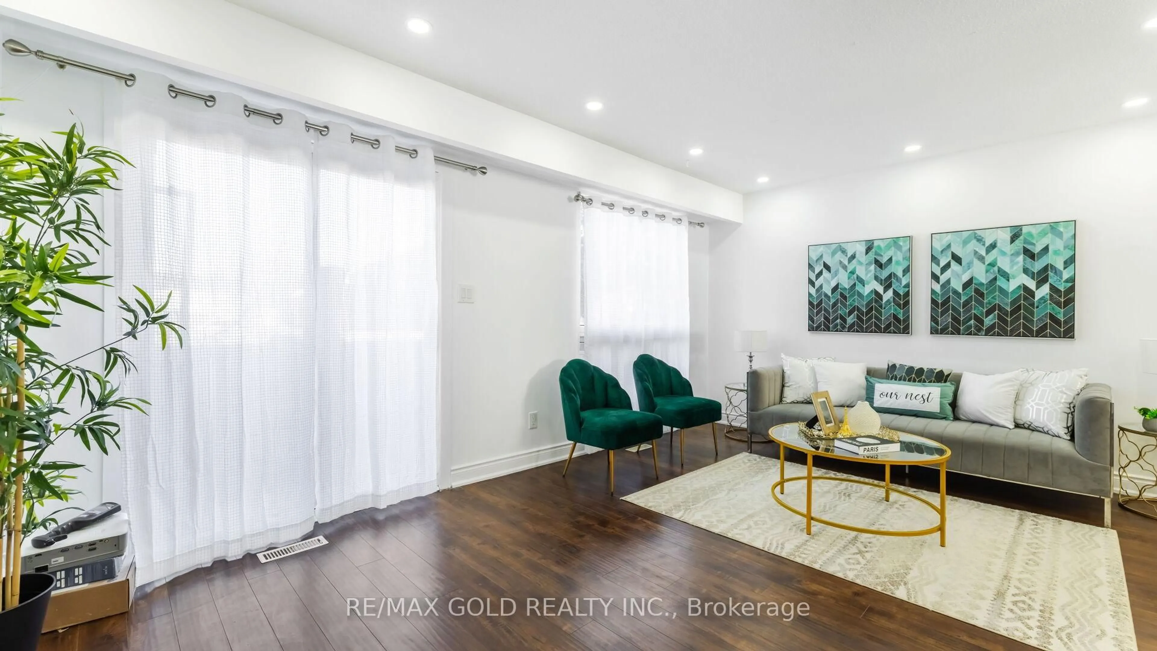 Living room with furniture, wood/laminate floor for 7560 Goreway Dr #18, Mississauga Ontario L4T 2V2