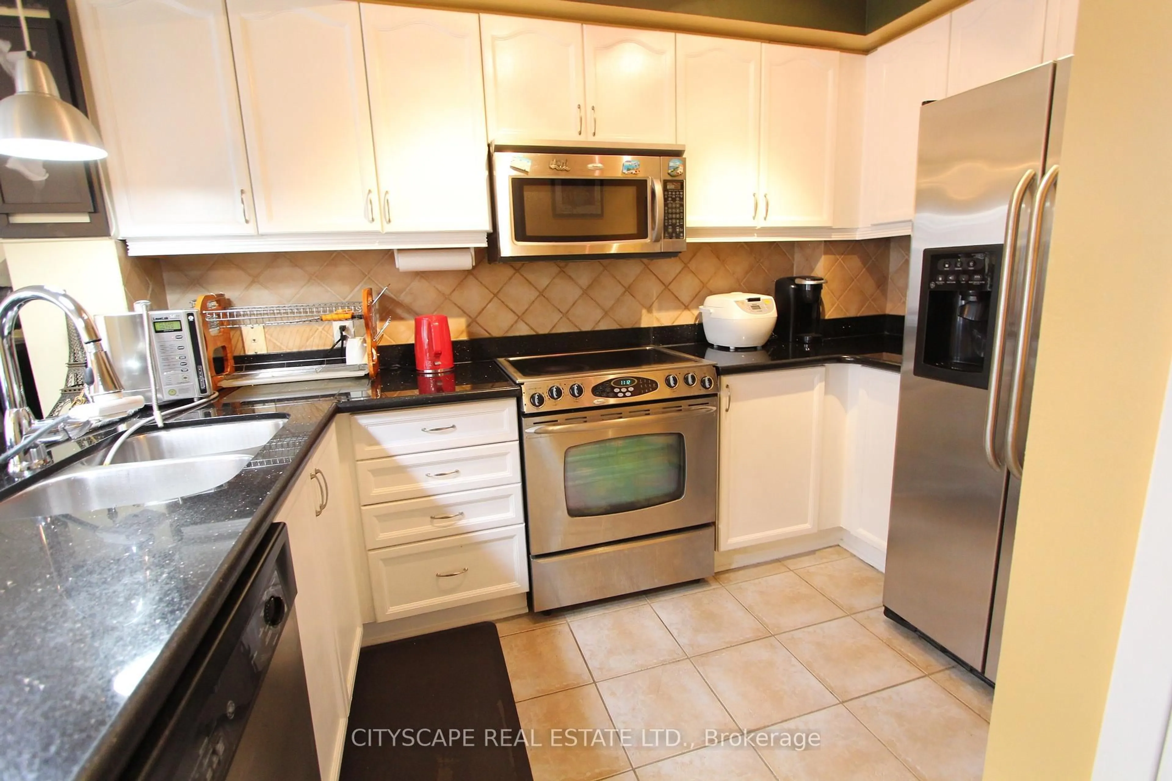 Standard kitchen, ceramic/tile floor for 3055 Elmcreek Rd #7, Mississauga Ontario L5B 4J9