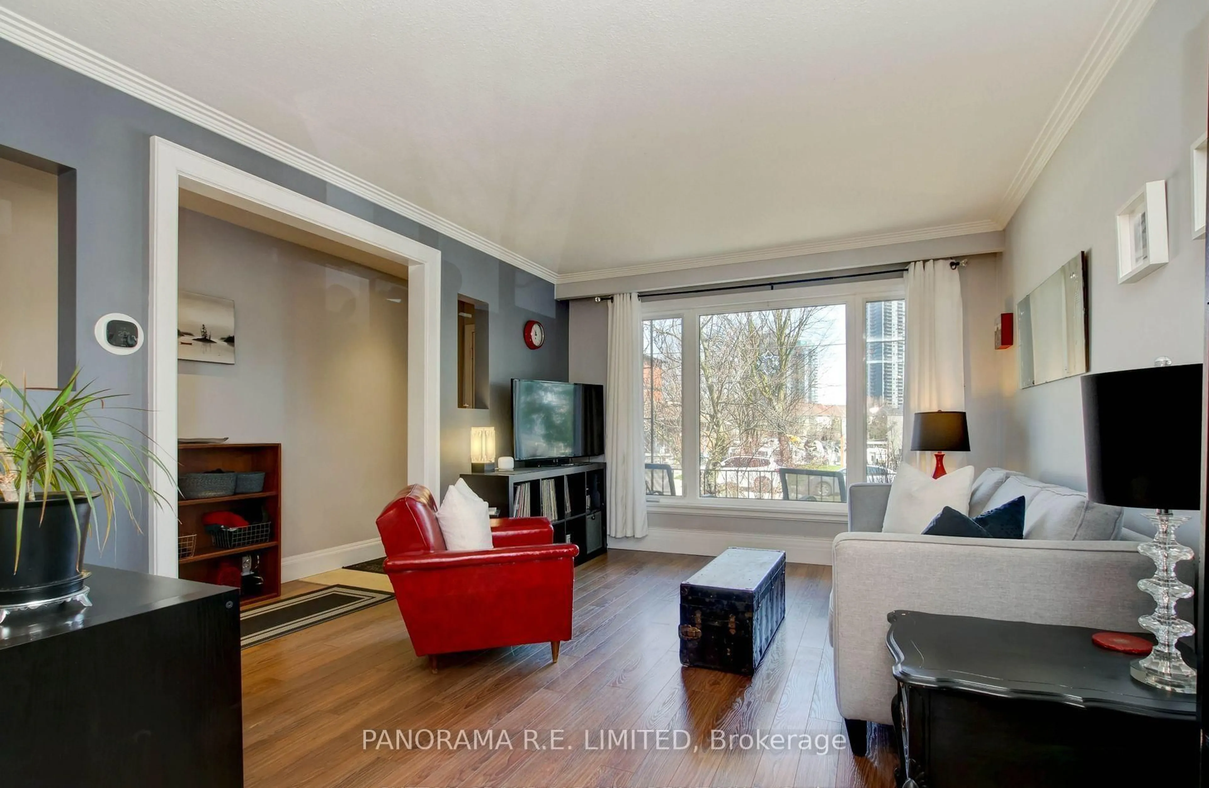 Living room with furniture, wood/laminate floor for 14 Louisa St, Toronto Ontario M8V 2K6