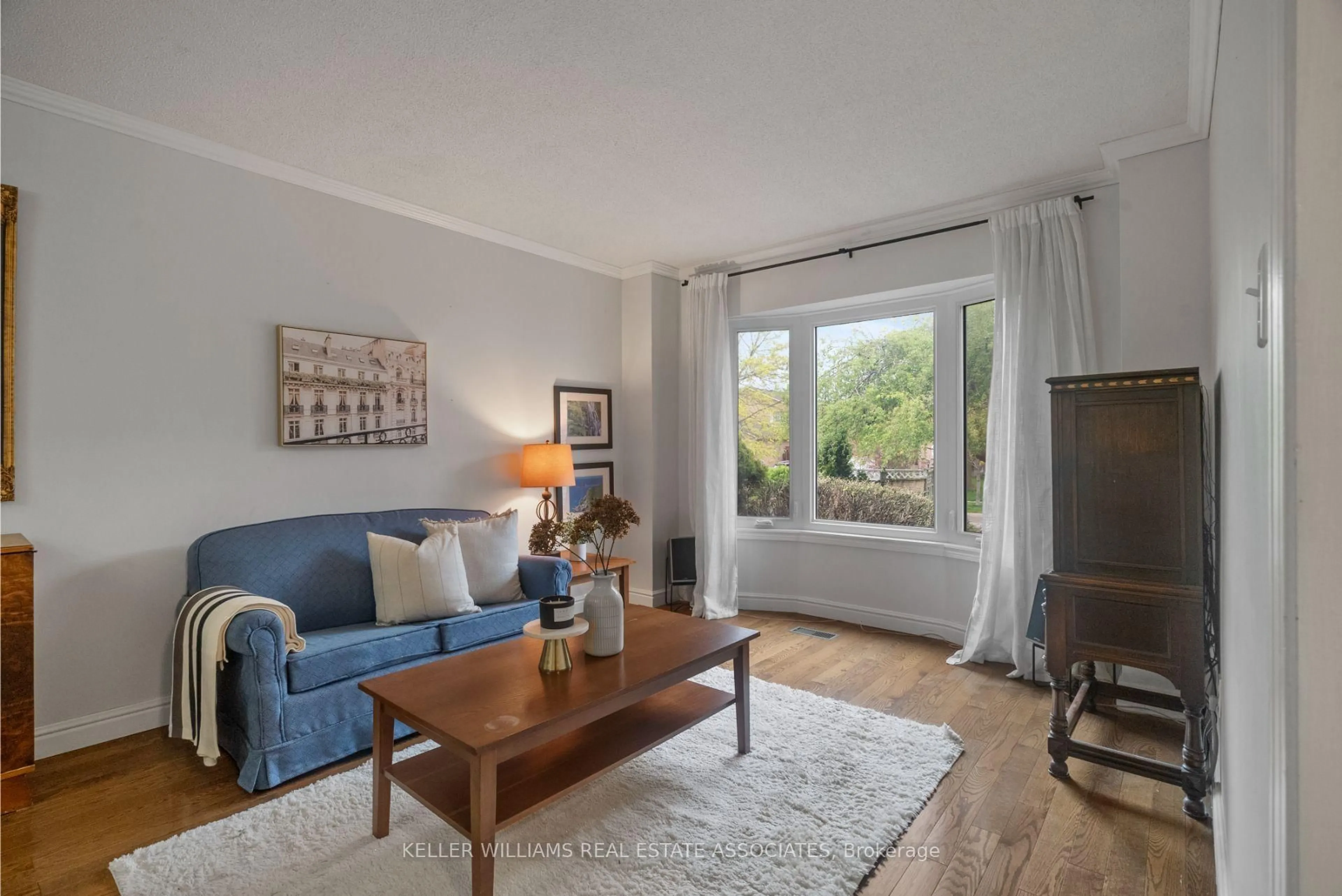 Living room with furniture, wood/laminate floor for 57 Webster Way, Halton Hills Ontario L7G 5J5