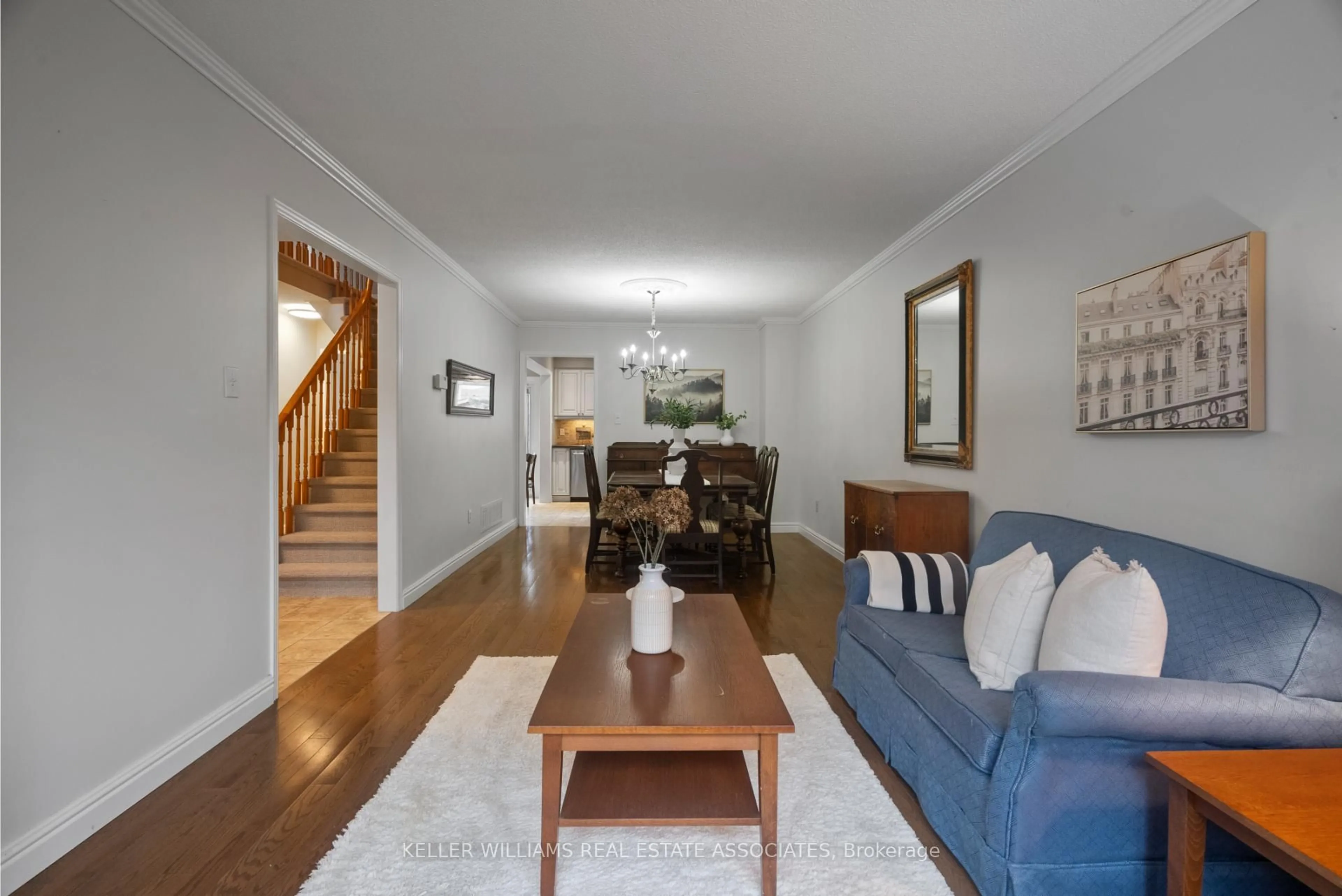 Living room with furniture, wood/laminate floor for 57 Webster Way, Halton Hills Ontario L7G 5J5
