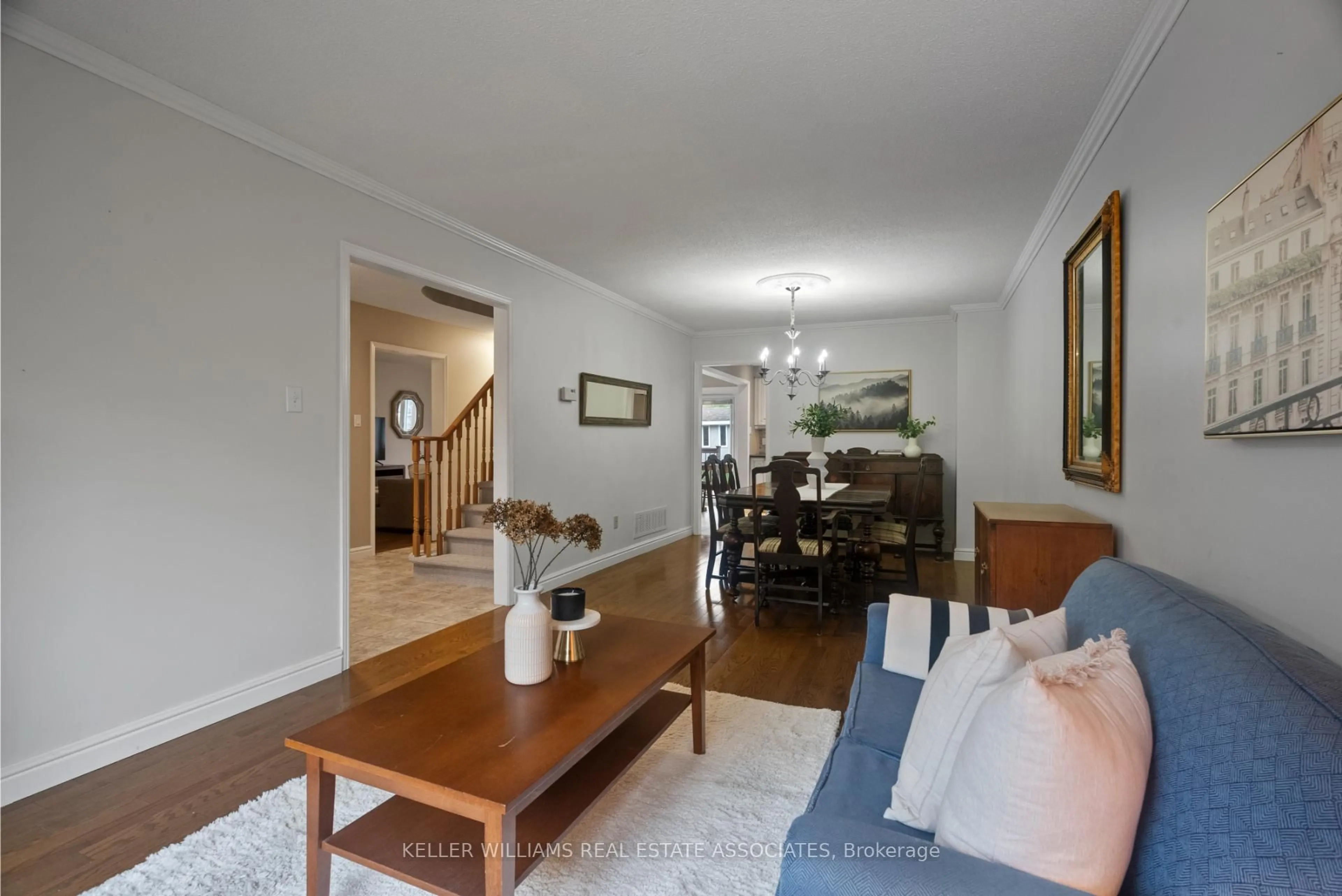 Living room with furniture, wood/laminate floor for 57 Webster Way, Halton Hills Ontario L7G 5J5