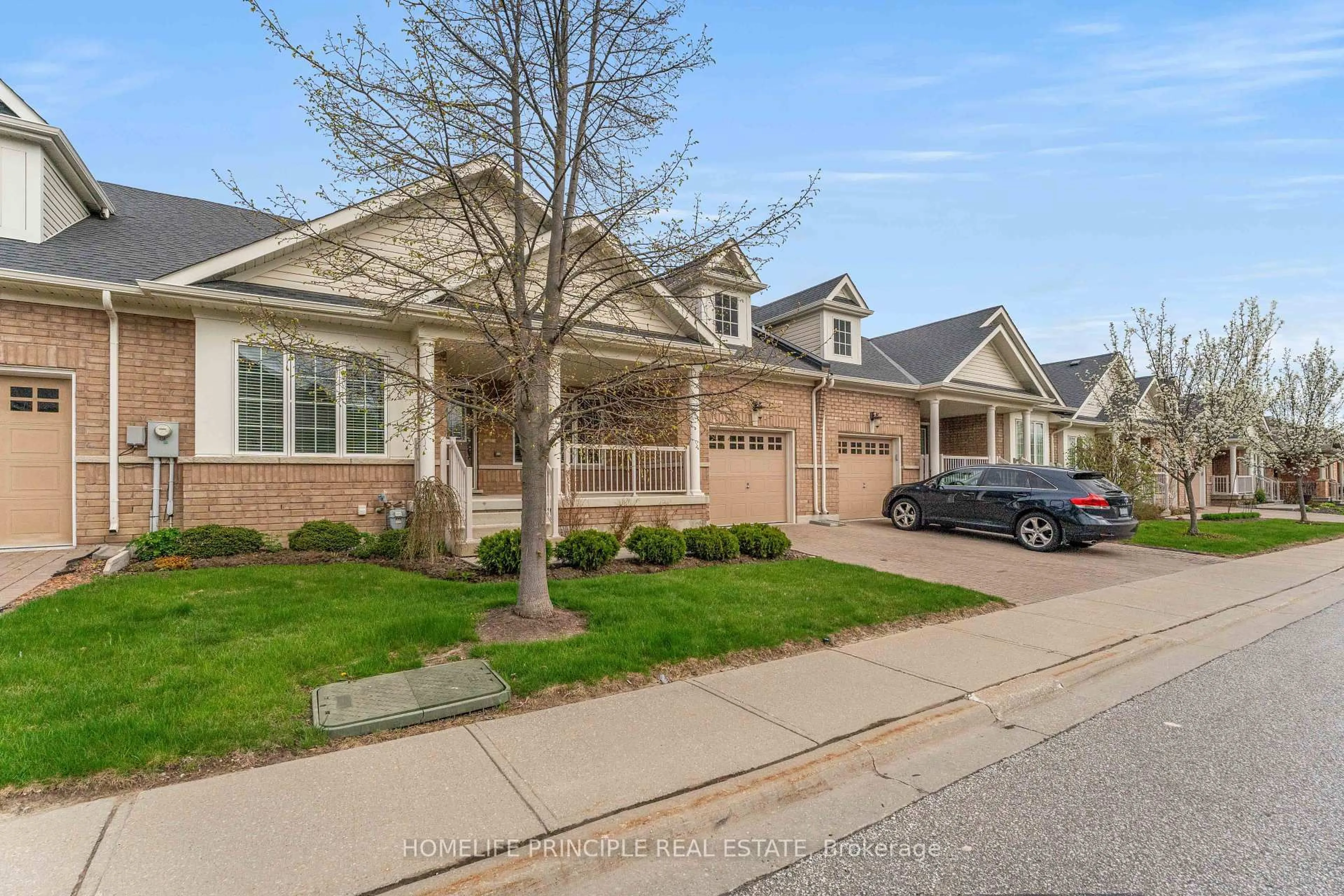 Home with brick exterior material, street for 12 Lacorra Way, Brampton Ontario L6R 3P2