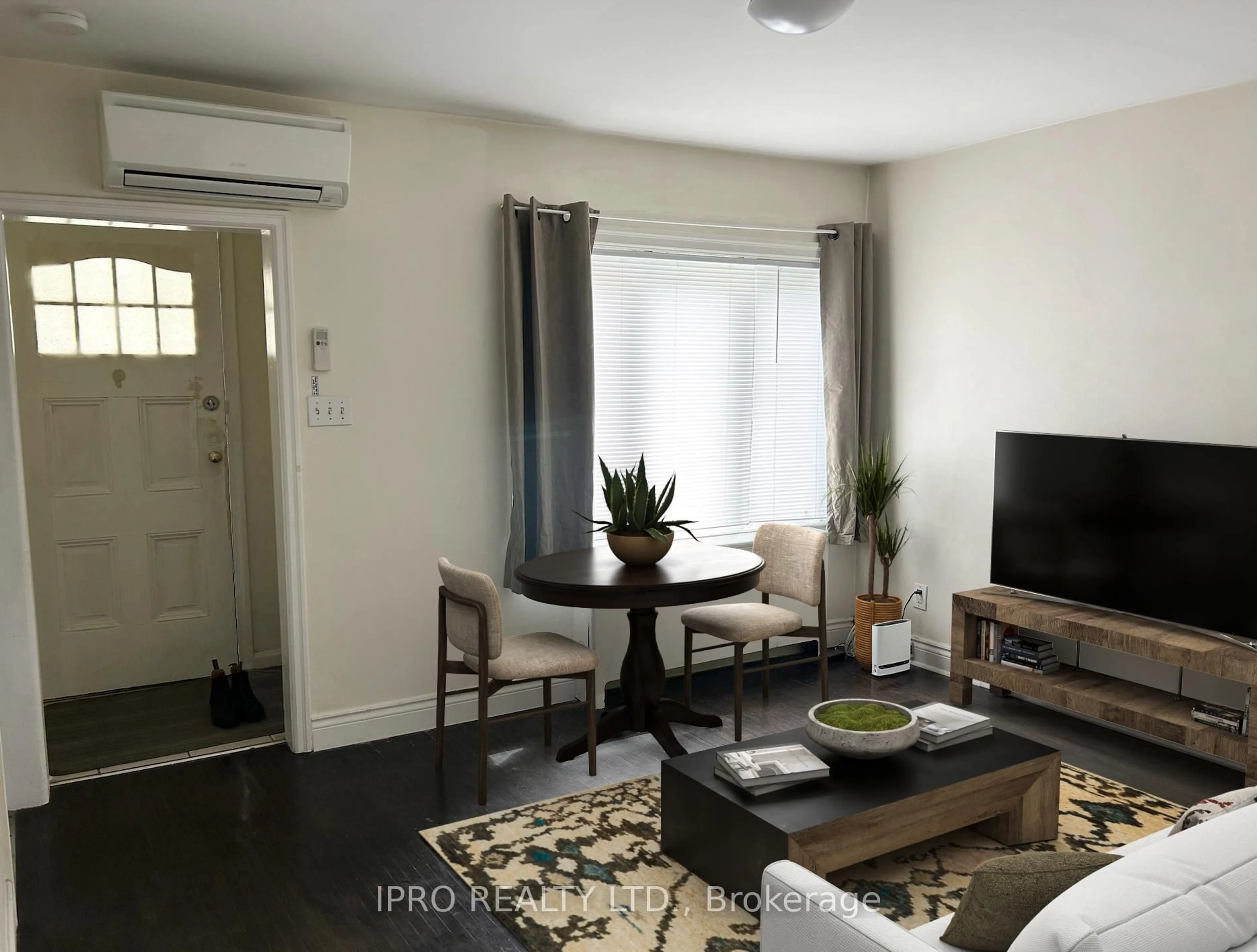 Living room with furniture, wood/laminate floor for 20 Fifteenth St, Toronto Ontario M8V 3J4