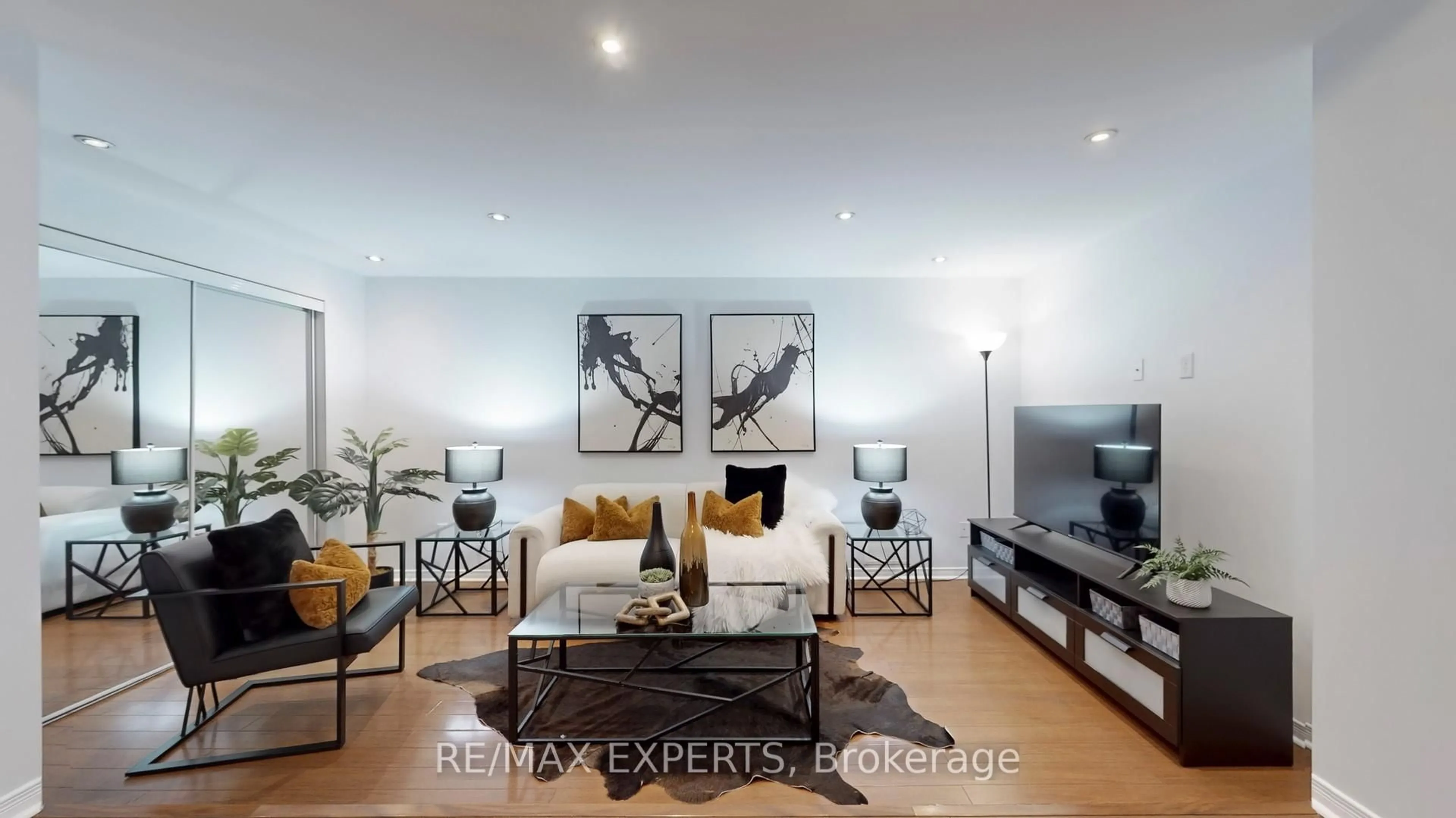 Living room with furniture, wood/laminate floor for 8 Mare Cres, Toronto Ontario M9W 7E6