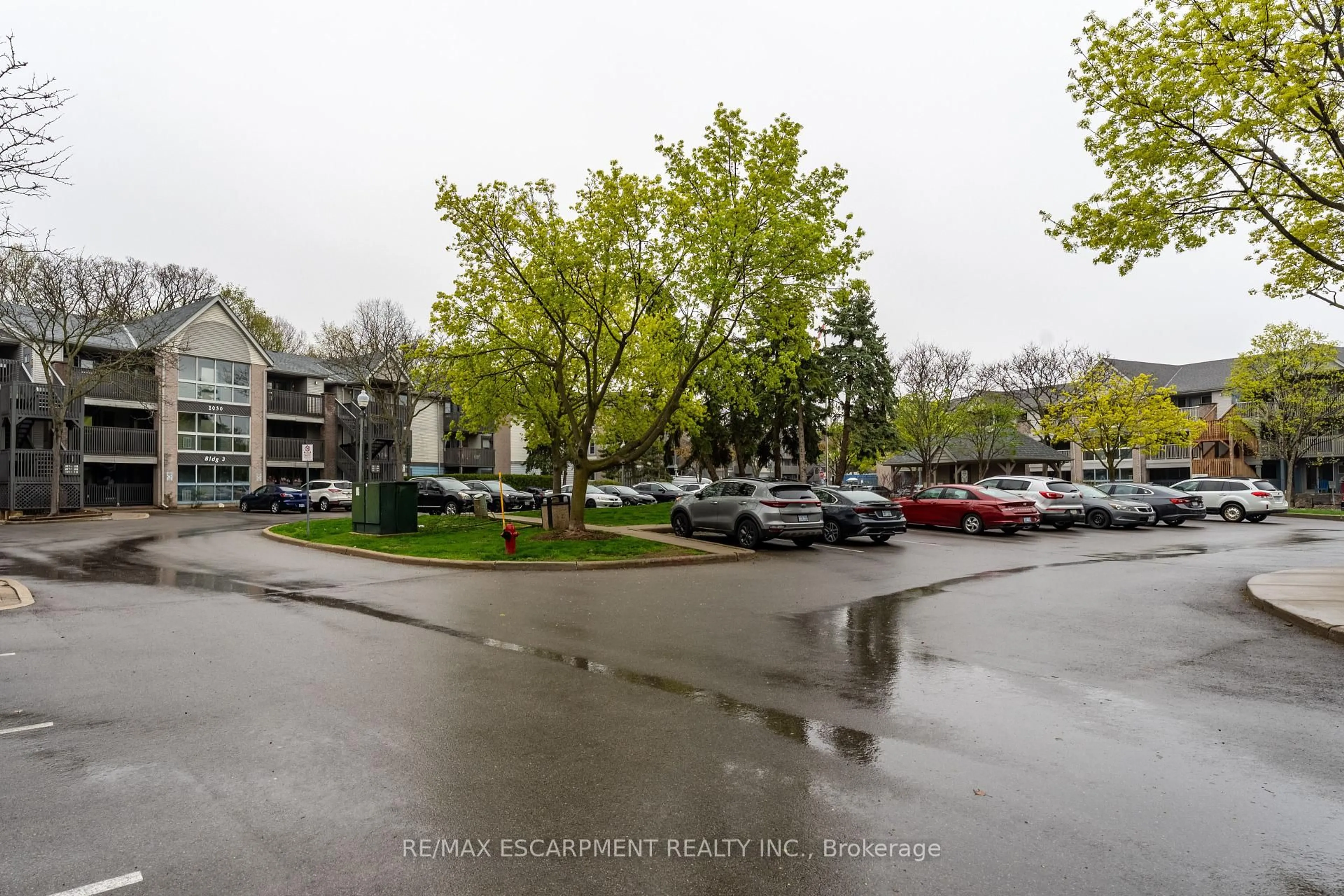 A pic from outside/outdoor area/front of a property/back of a property/a pic from drone, street for 2030 Cleaver Ave #302, Burlington Ontario L7M 4C3