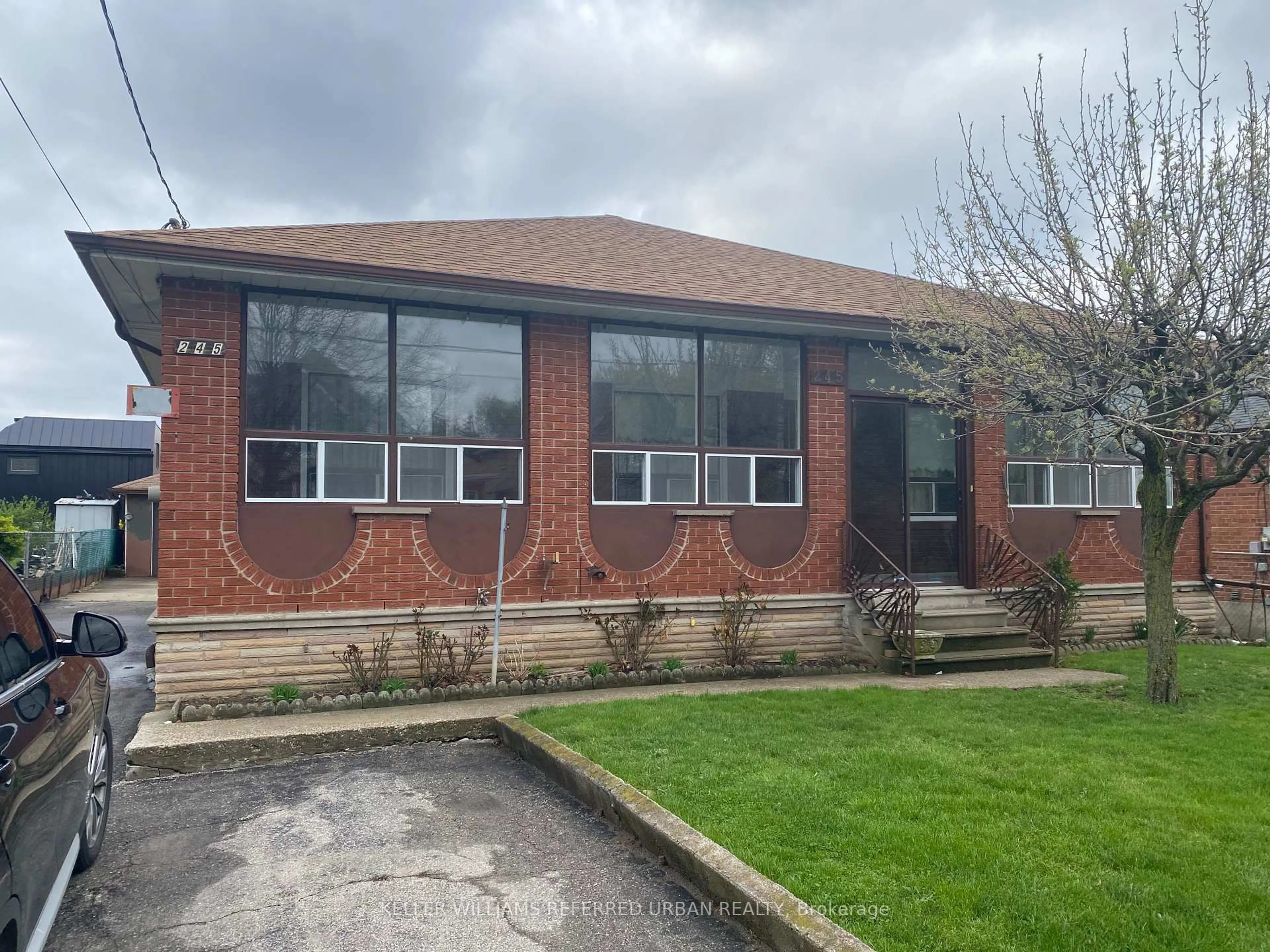 Home with brick exterior material, building for 245 Falstaff Ave, Toronto Ontario M6L 2G3
