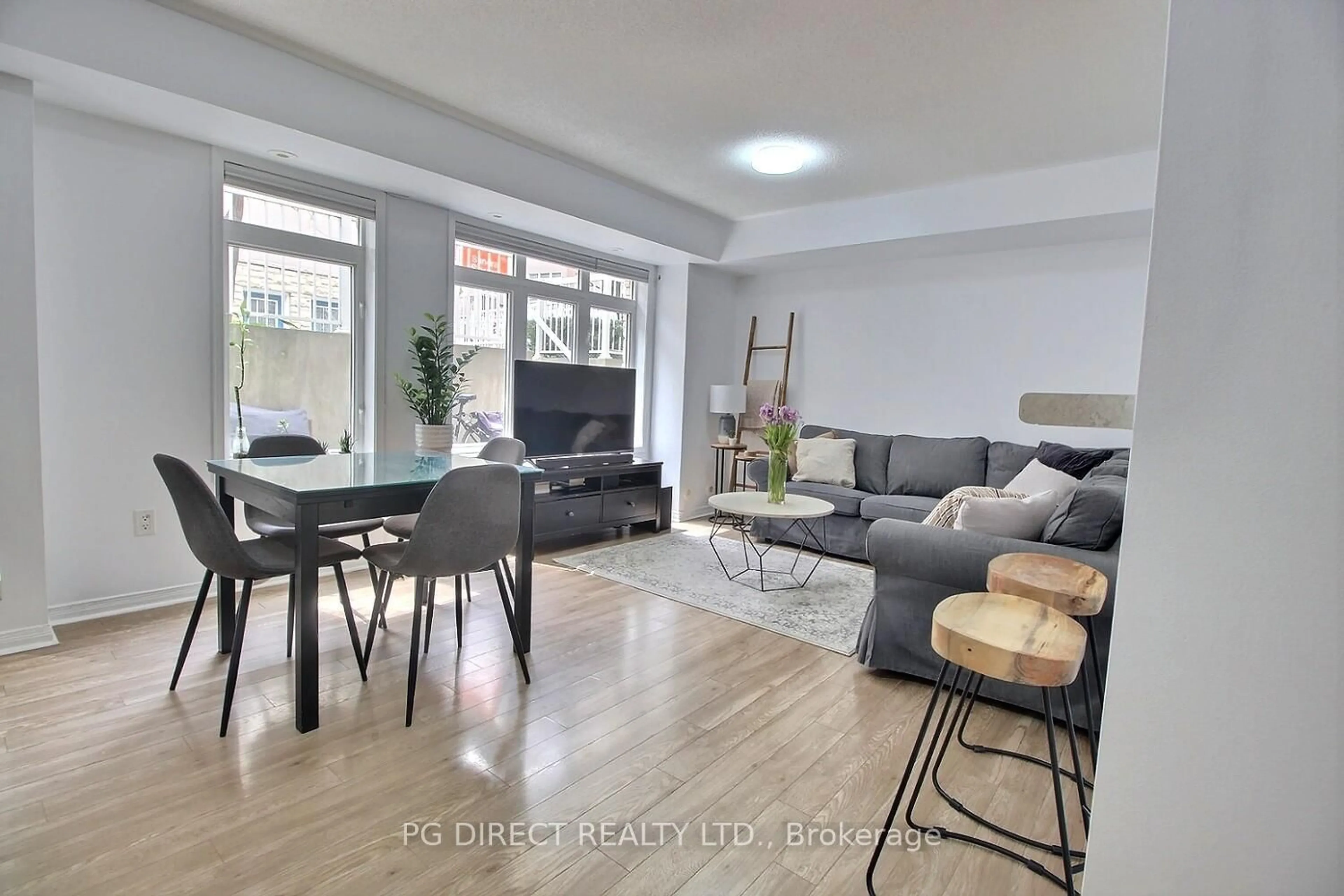 Living room with furniture, unknown for 50 Turntable Cres #57, Toronto Ontario M6H 4K8