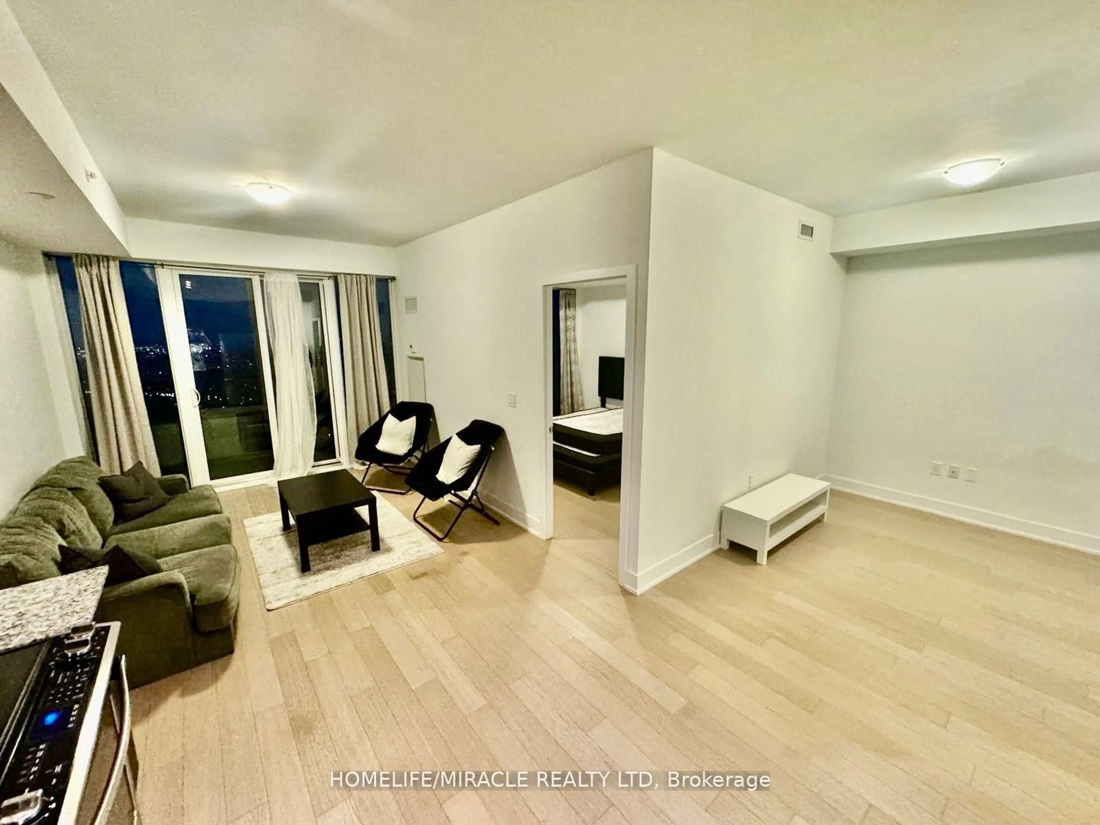 Living room with furniture, unknown for 30 Shore Breeze Dr Dr #5901, Toronto Ontario M8V 1A1