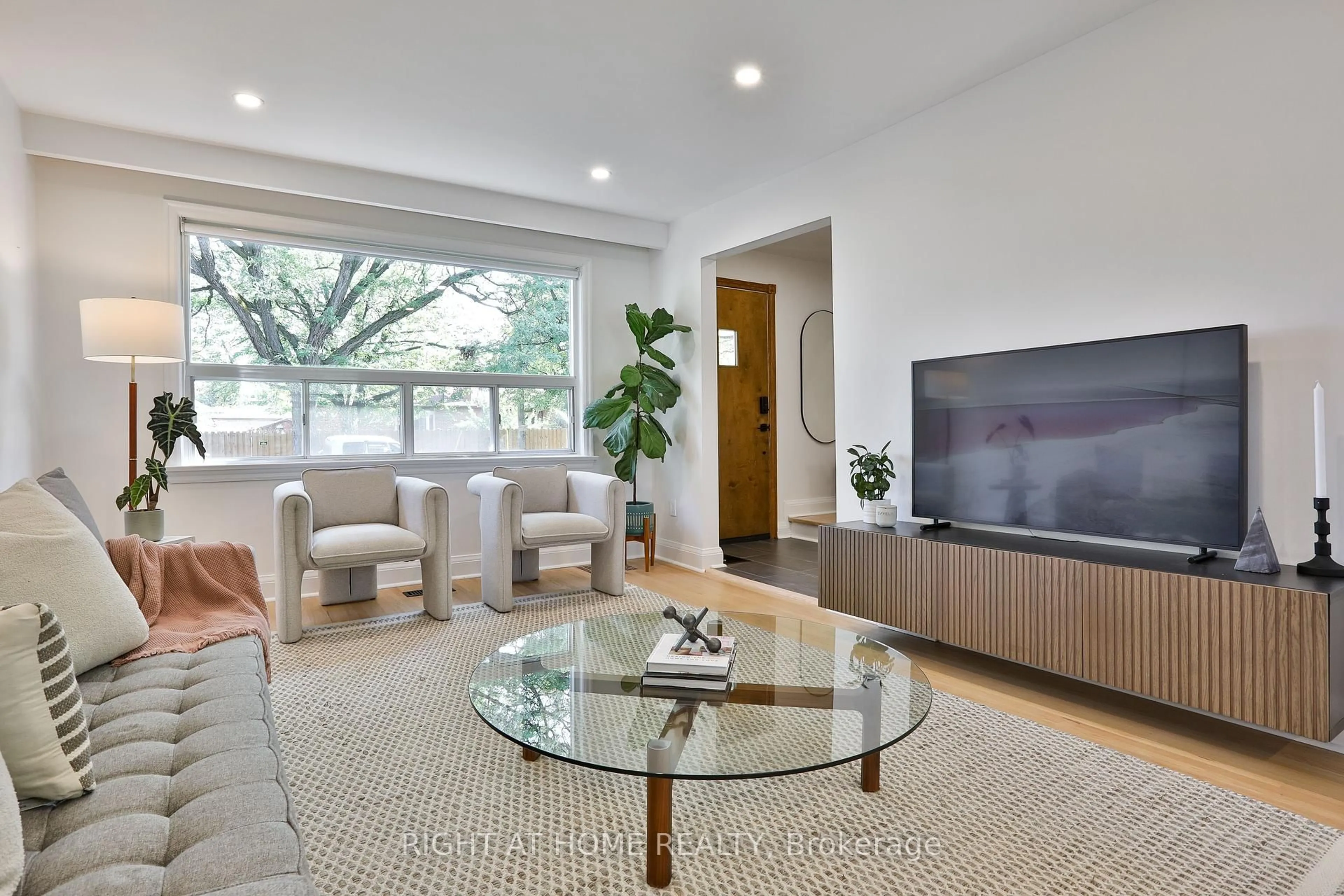 Living room with furniture, wood/laminate floor for 20 Amesbury Dr, Toronto Ontario M6M 4H4