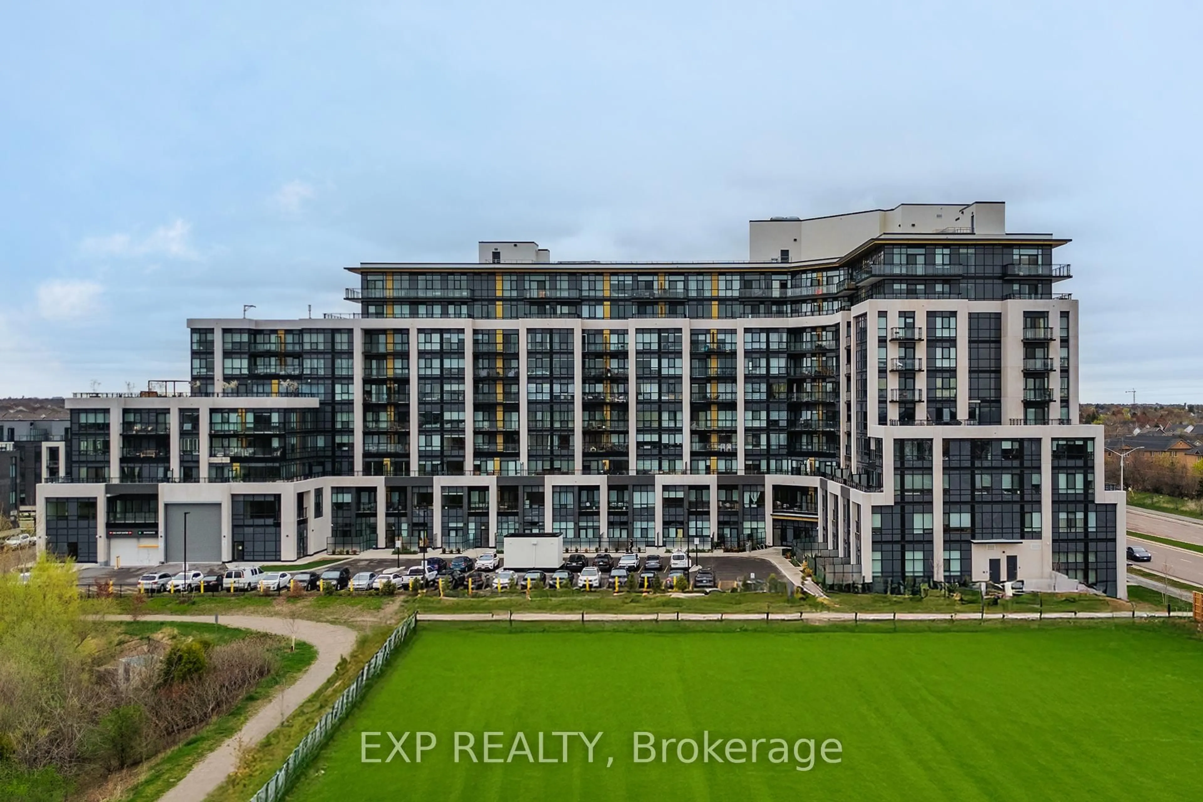A pic from outside/outdoor area/front of a property/back of a property/a pic from drone, city buildings view from balcony for 405 Dundas St #307, Oakville Ontario L6M 5P9