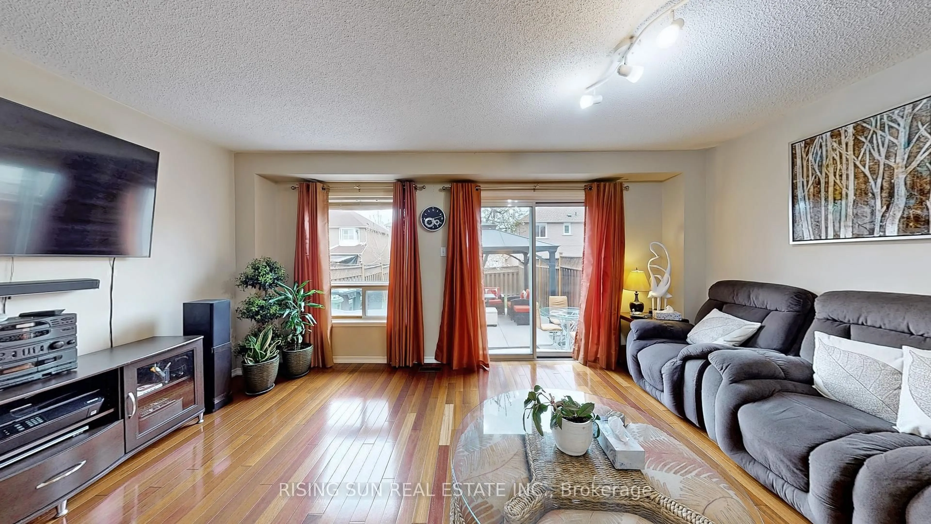 Living room with furniture, wood/laminate floor for 11 Kitto Crt, Brampton Ontario L6Y 5A9