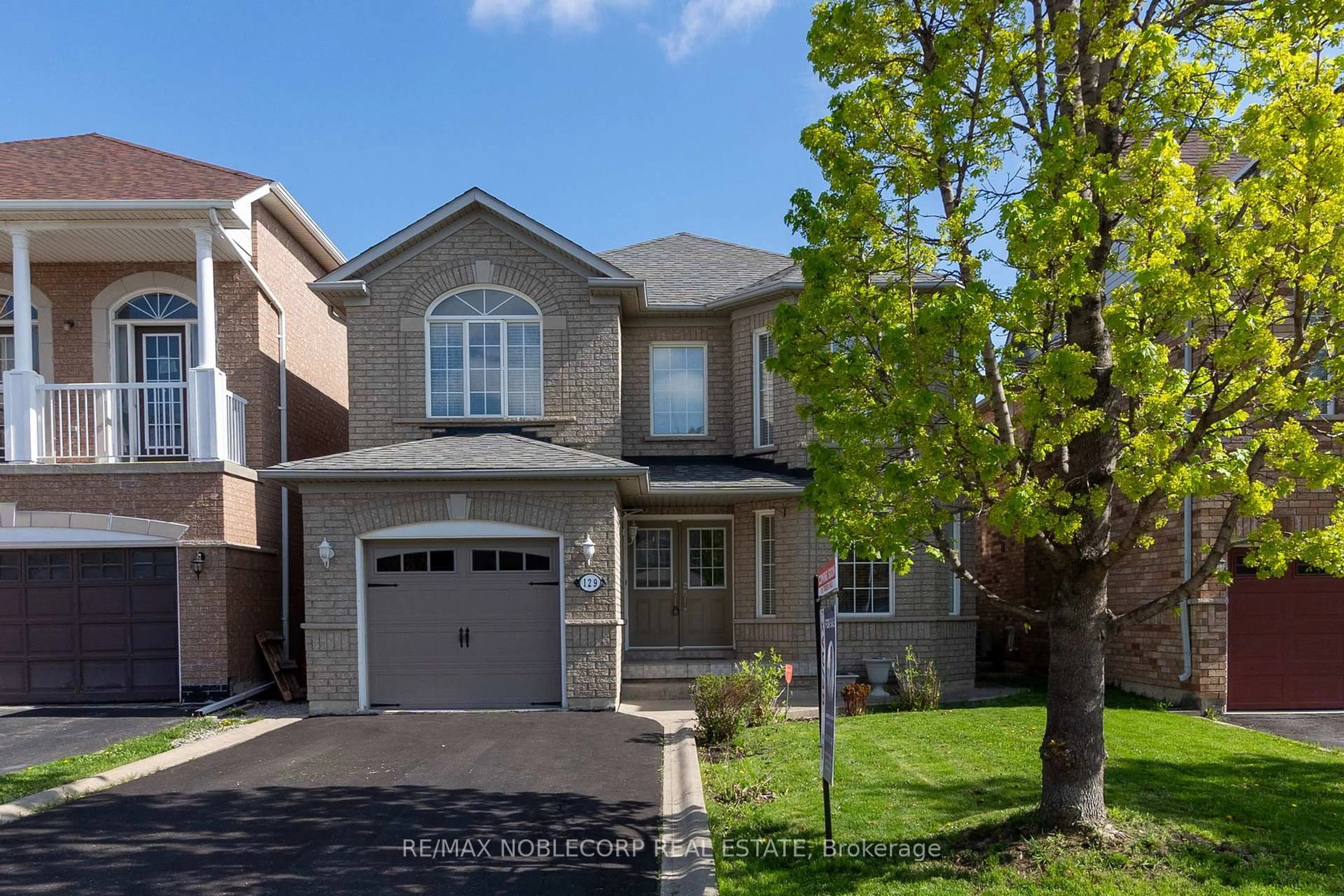 Home with brick exterior material, street for 129 Queen Mary Dr, Brampton Ontario L7A 2R5