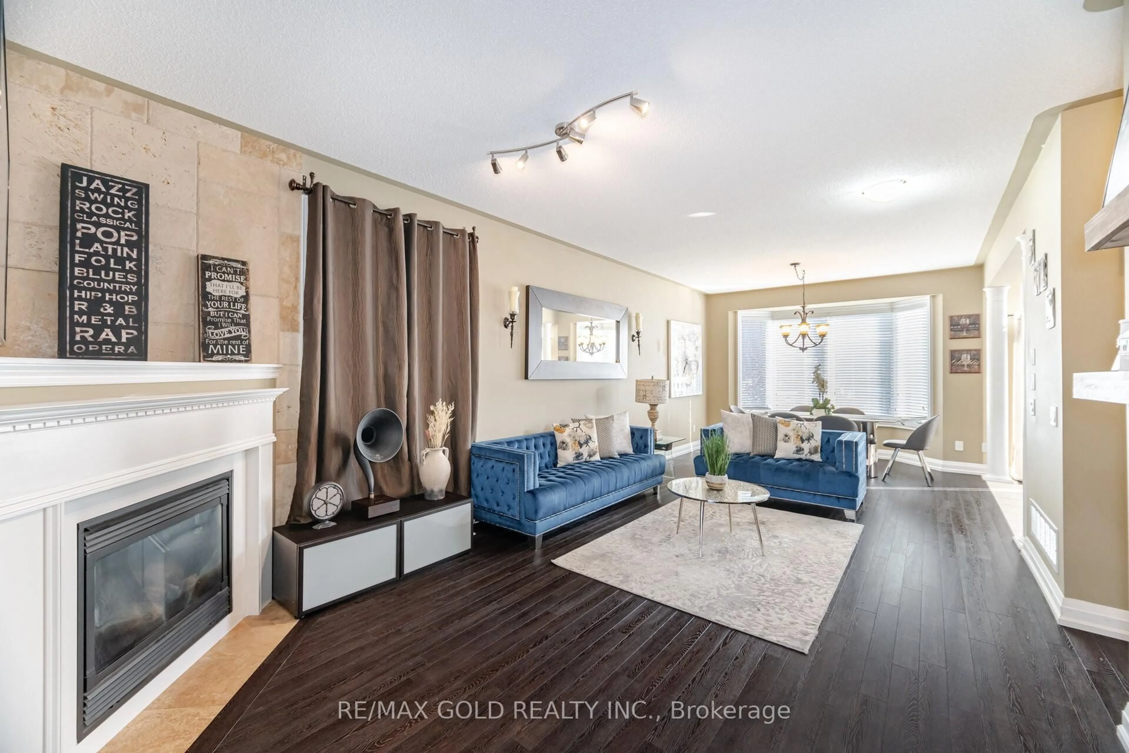 Living room with furniture, wood/laminate floor for 36 Edenfield St, Brampton Ontario L6R 0M7