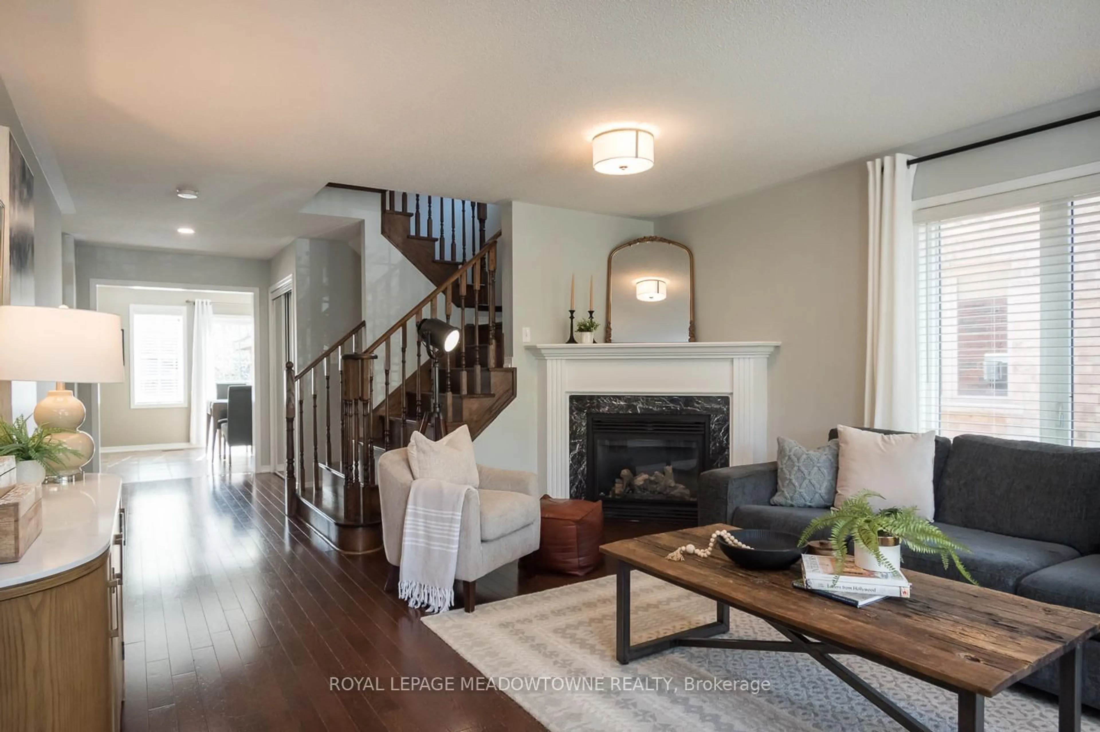Living room with furniture, wood/laminate floor for 292 Giddings Cres, Milton Ontario L9T 7A9