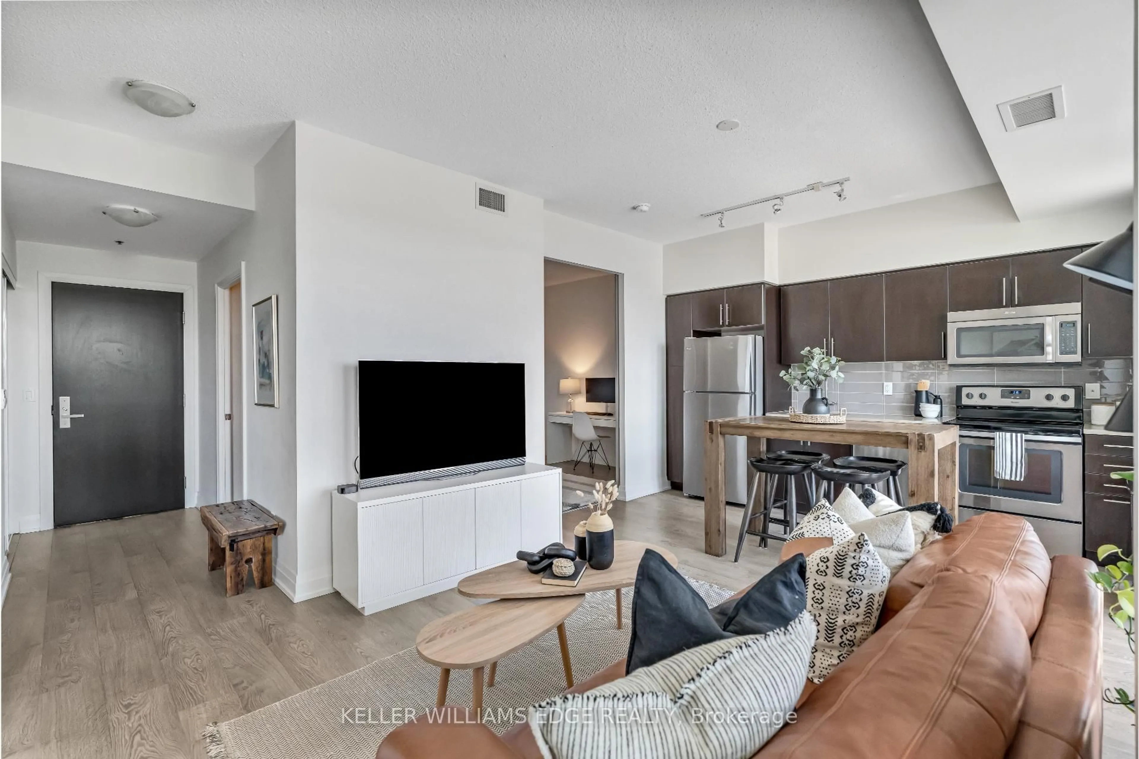 Living room with furniture, unknown for 65 Speers Rd #413, Oakville Ontario L6K 0J1