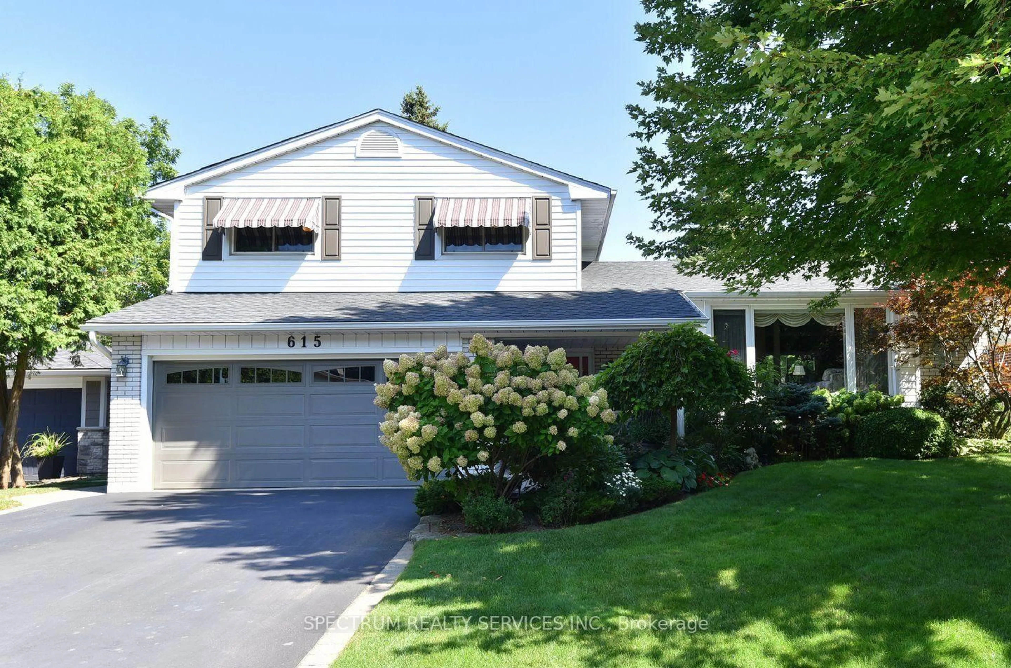 Home with vinyl exterior material, street for 615 Cherrywood Dr, Burlington Ontario L7T 3W9