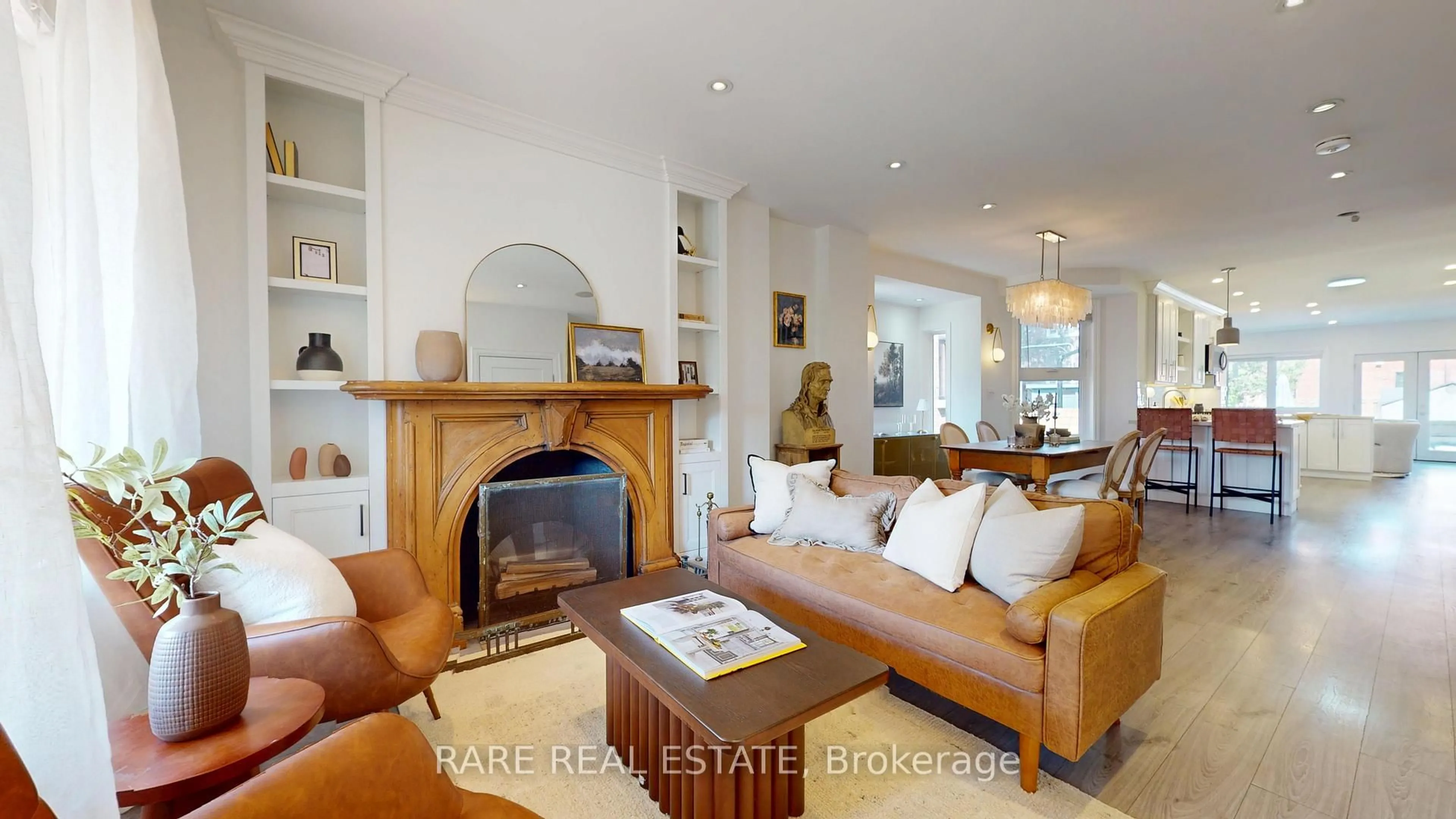 Living room with furniture, wood/laminate floor for 879 Shaw St, Toronto Ontario M6G 3M3