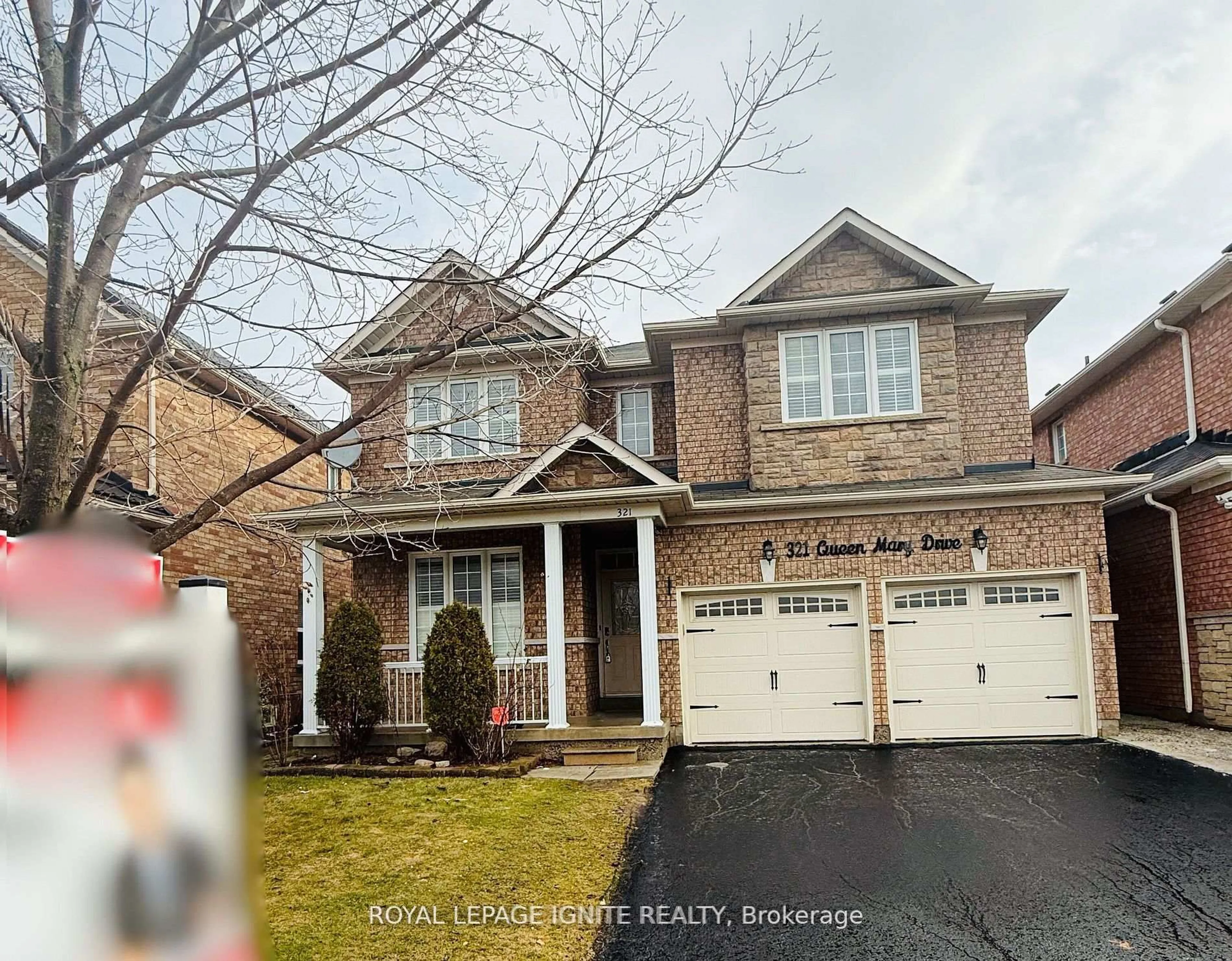 Home with brick exterior material, street for 321 Queen Mary Dr, Brampton Ontario L7A 3S6