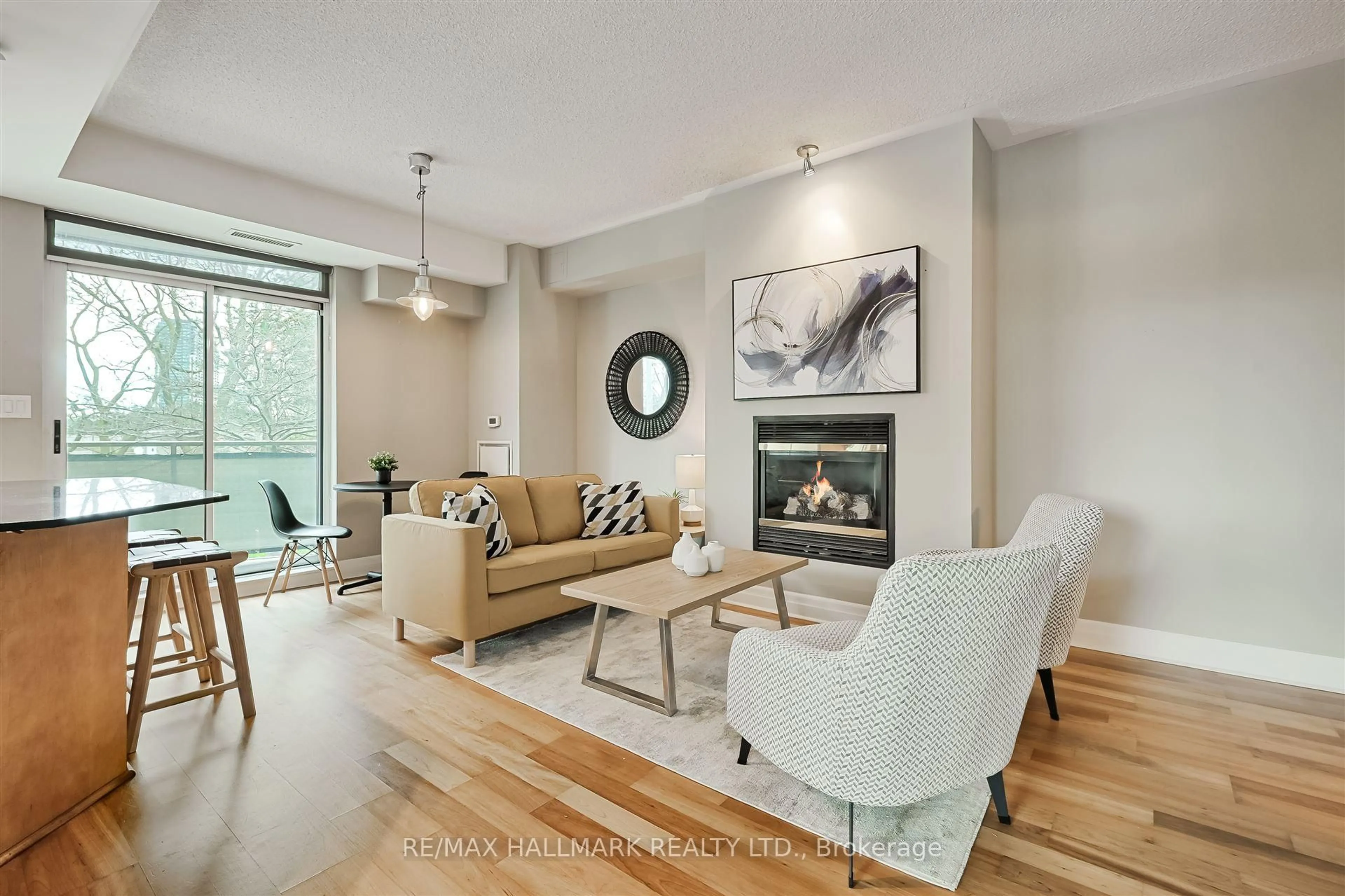 Living room with furniture, wood/laminate floor for 80 Palace Pier Crt #201, Toronto Ontario M8V 4C1