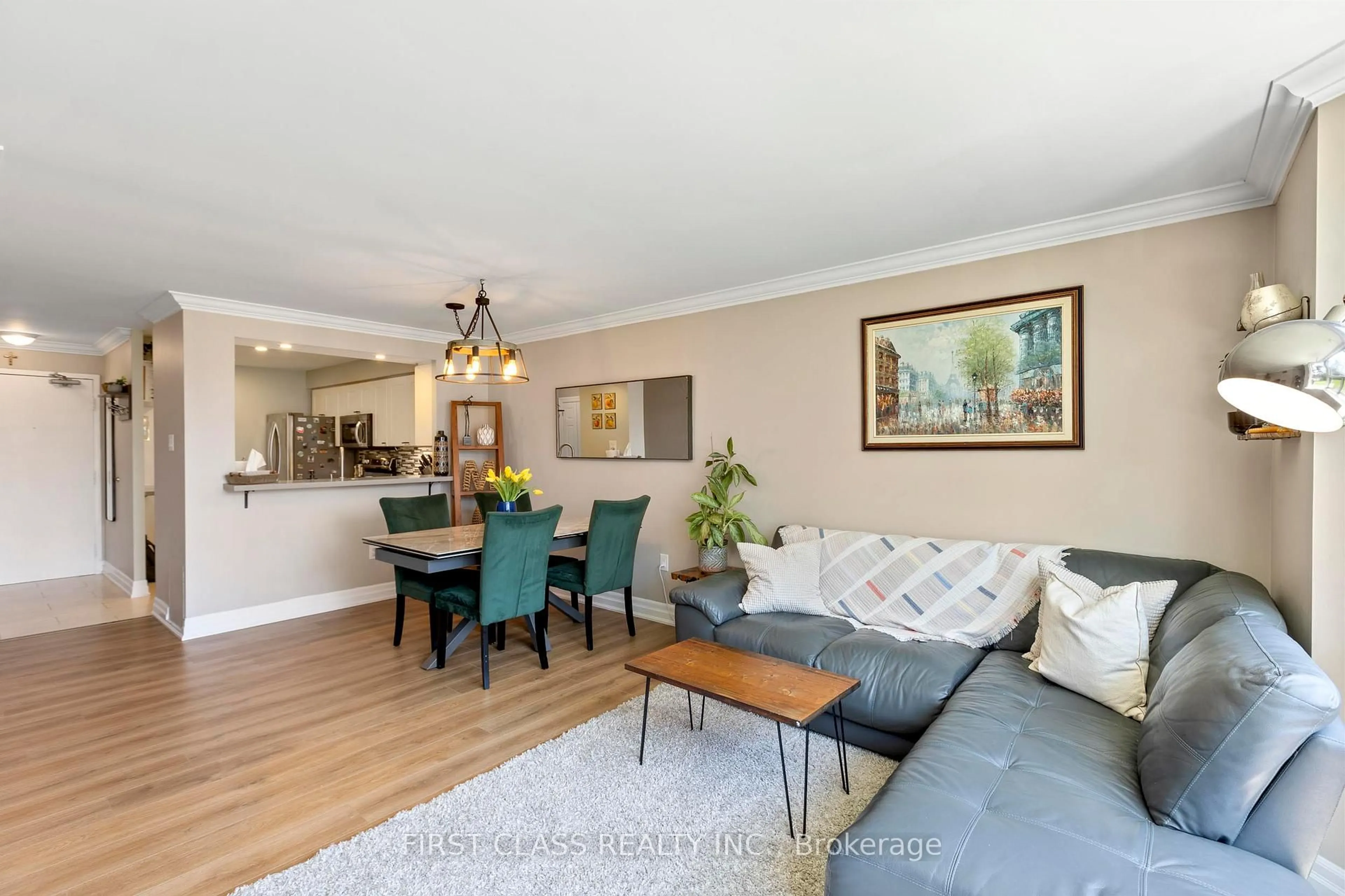 Living room with furniture, wood/laminate floor for 3845 Lake Shore Blvd #102, Toronto Ontario M8W 4Y3