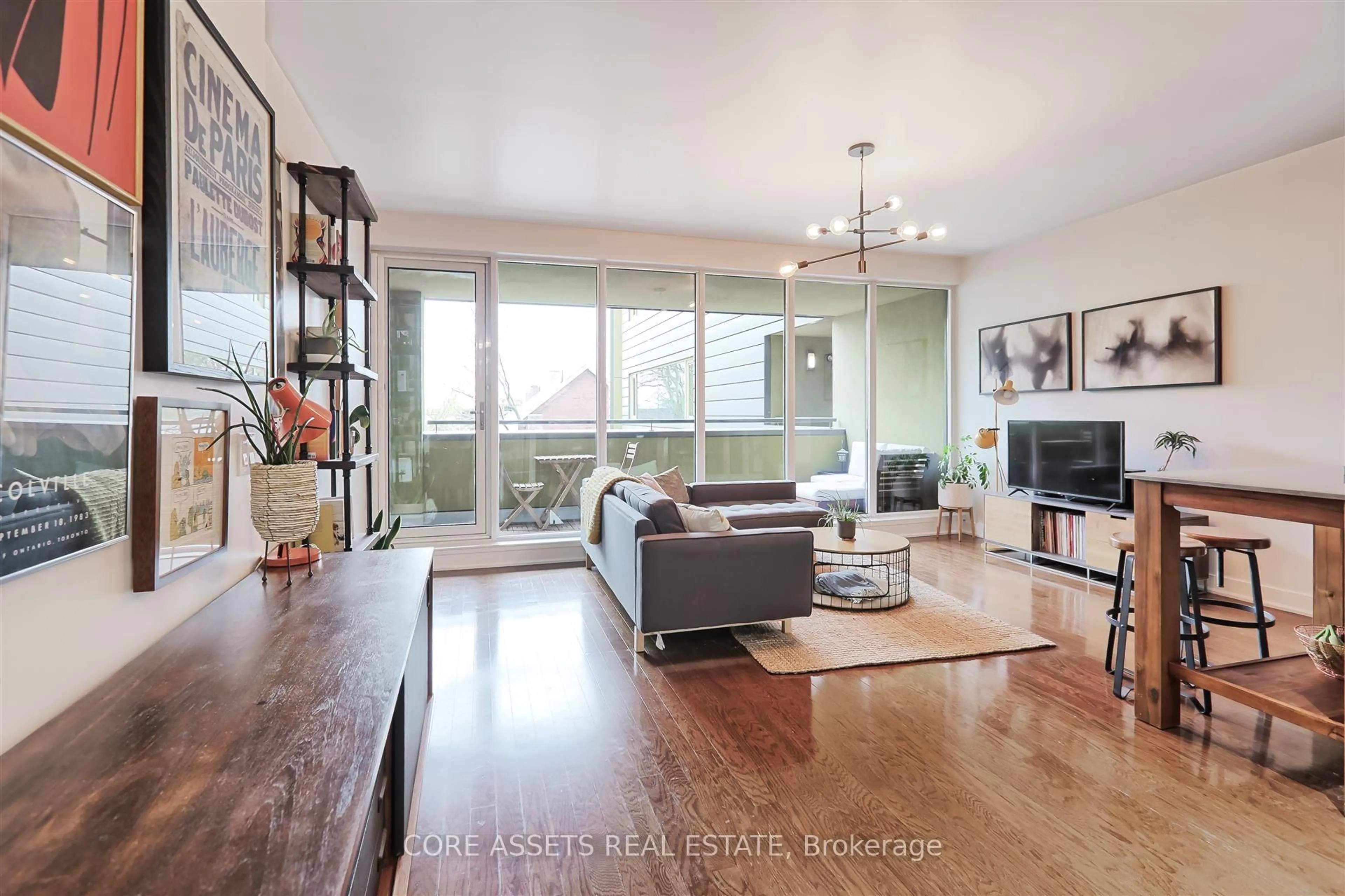 Living room with furniture, wood/laminate floor for 25 Ritchie Ave #303, Toronto Ontario M6R 2J6