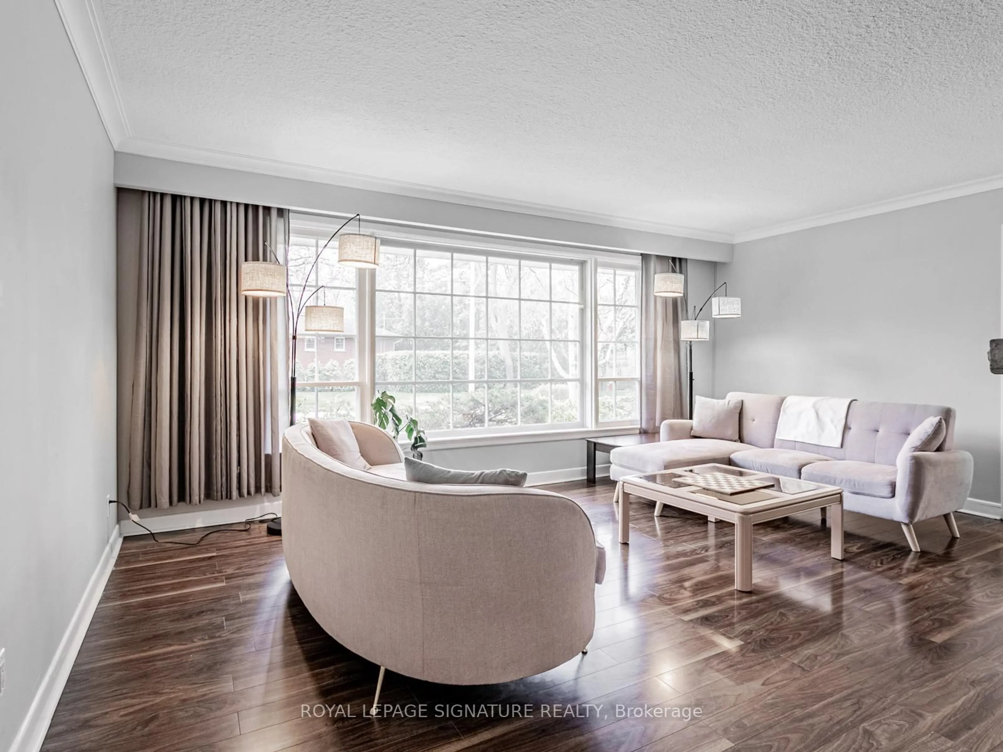 Living room with furniture, wood/laminate floor for 1447 Merrow Rd, Mississauga Ontario L5J 3C4