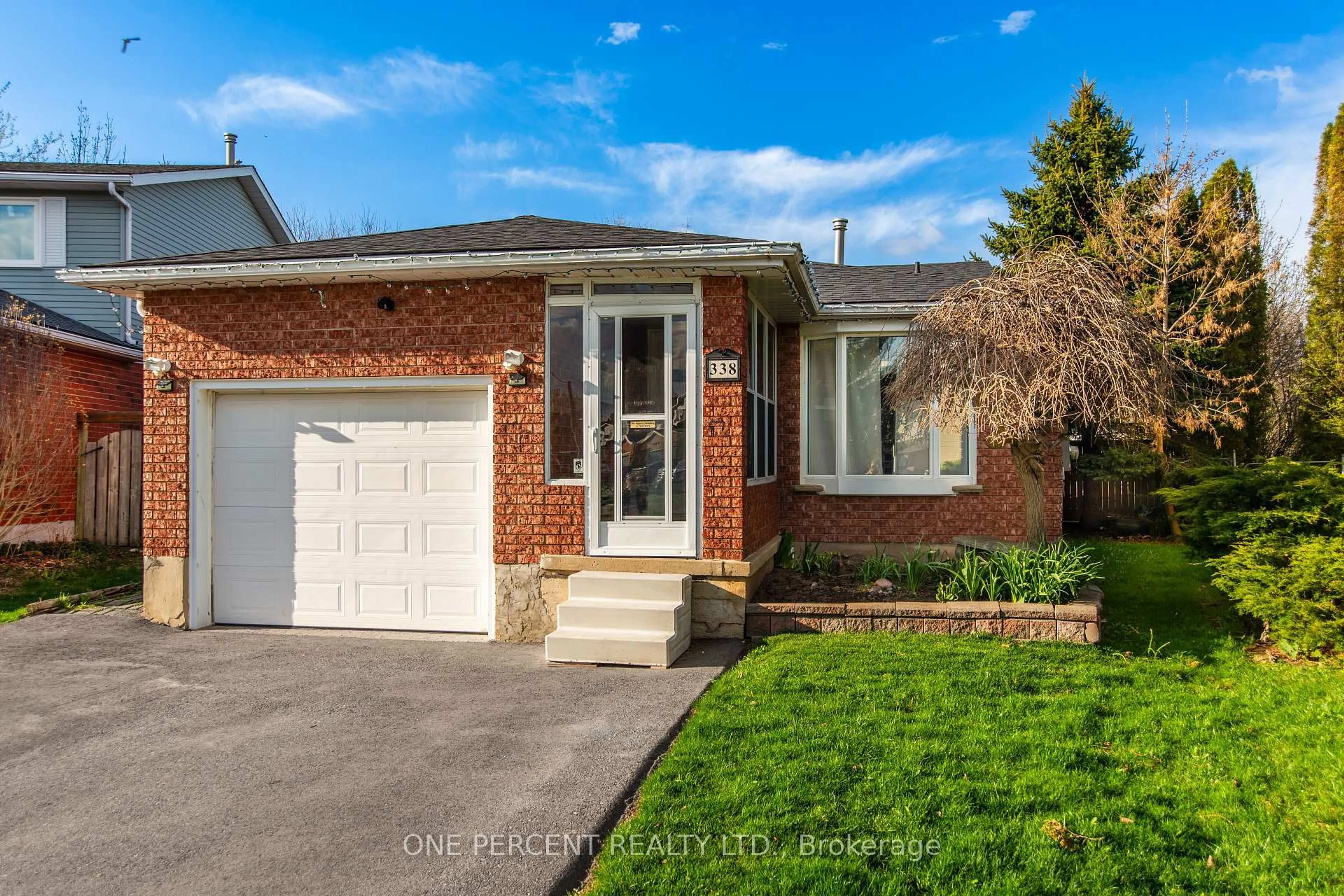 Home with brick exterior material, street for 338 Adams Crt, Orangeville Ontario L9W 4R7