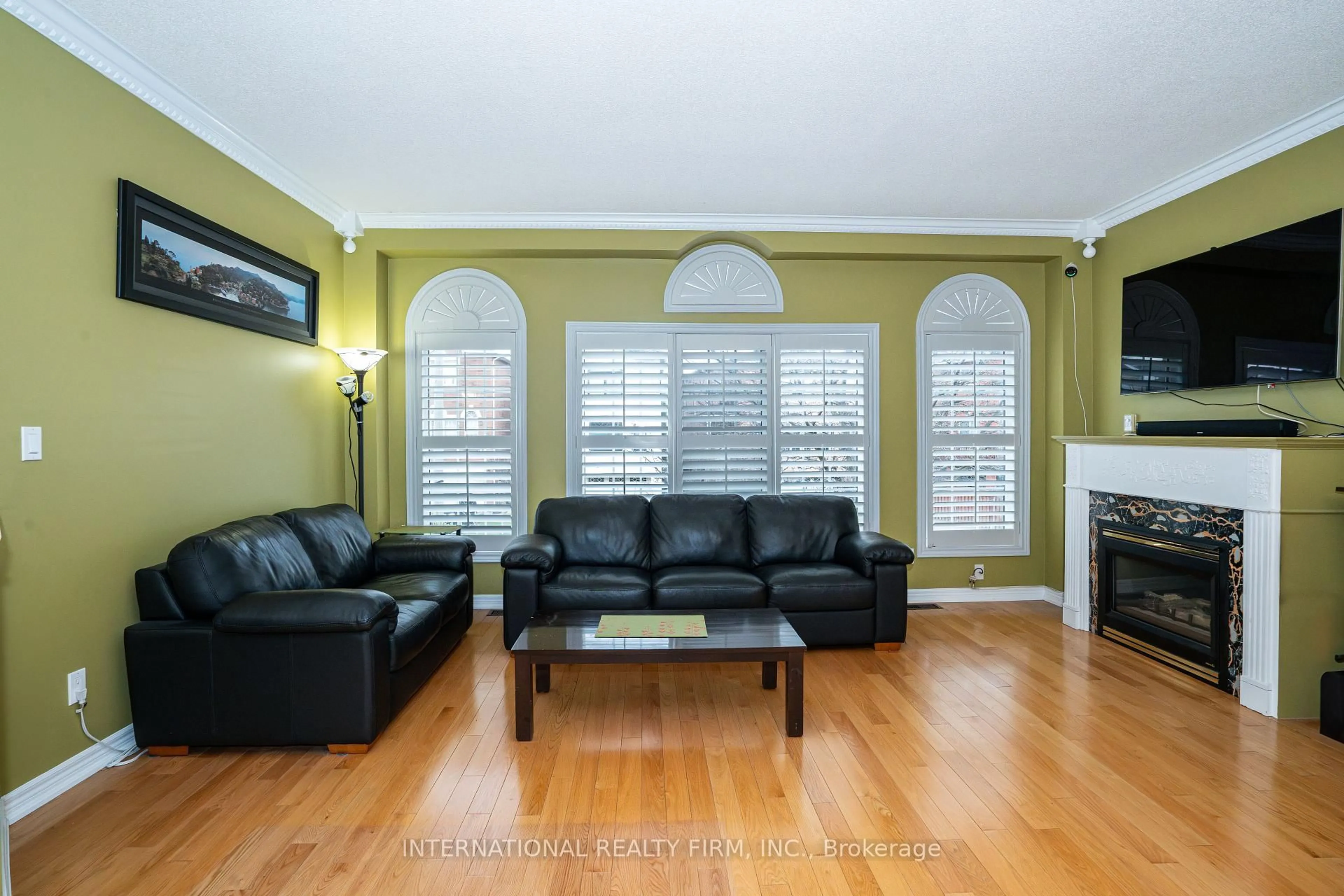Living room with furniture, wood/laminate floor for 8 Margaret Rose Crt, Toronto Ontario M9N 3Y6