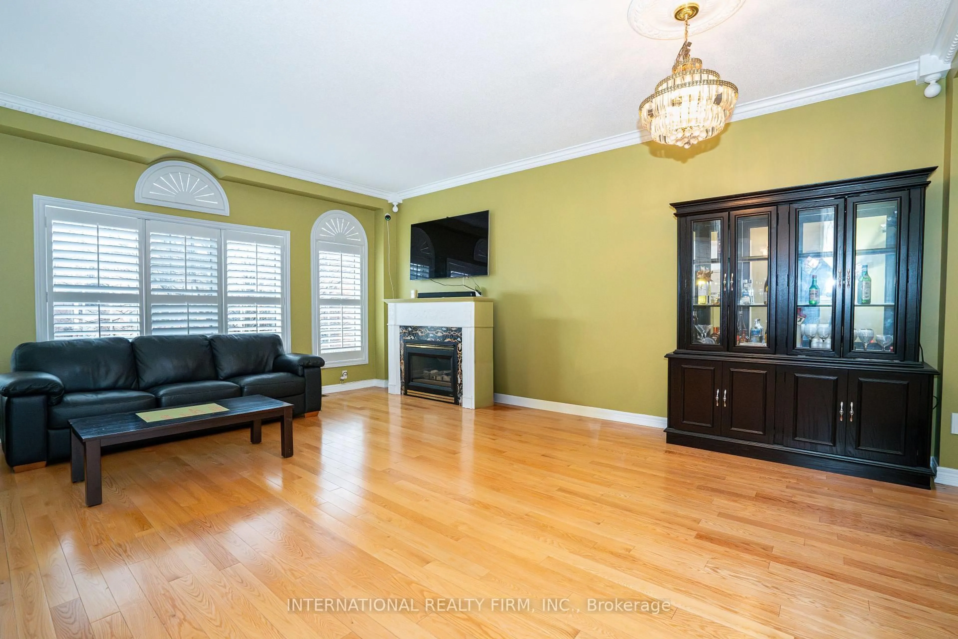 Living room with furniture, wood/laminate floor for 8 Margaret Rose Crt, Toronto Ontario M9N 3Y6