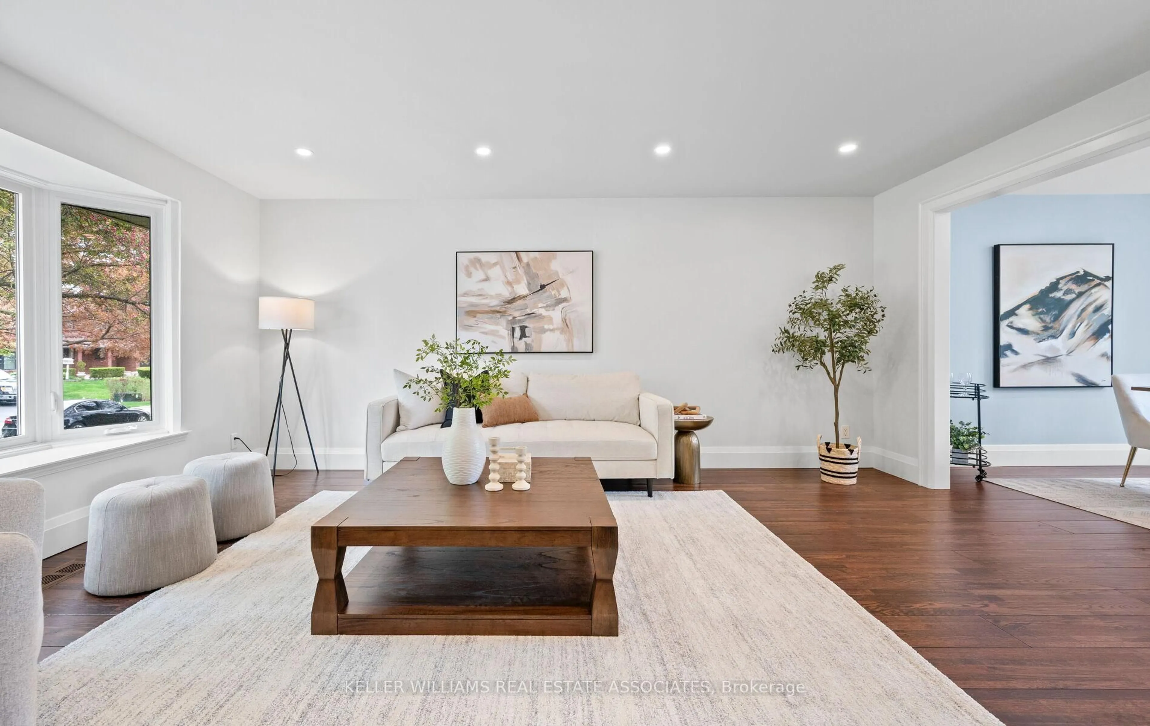 Living room with furniture, wood/laminate floor for 16 Amity Rd, Mississauga Ontario L5M 1P2