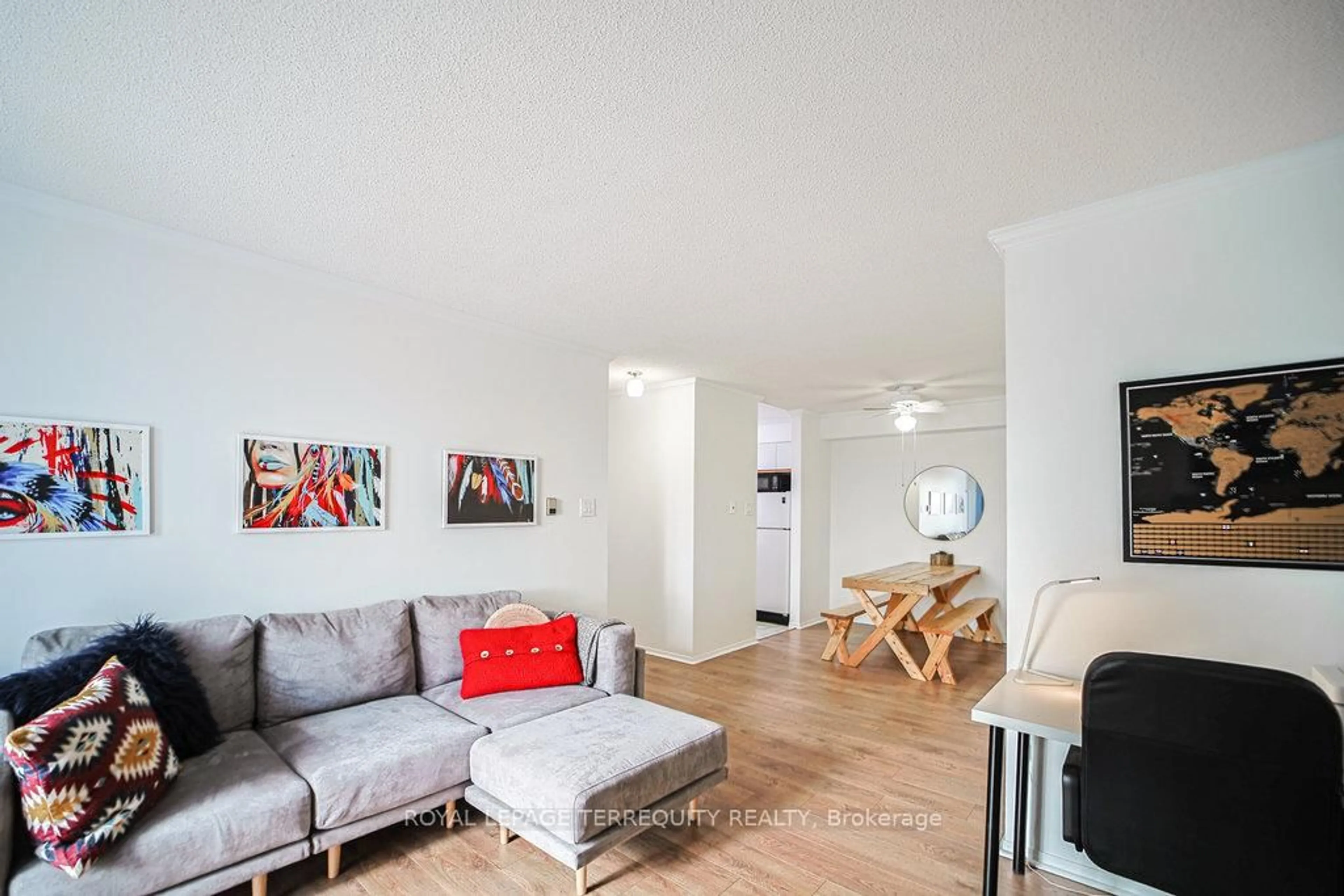 Living room with furniture, wood/laminate floor for 95 Trailwood Dr #832, Mississauga Ontario L4Z 3L2