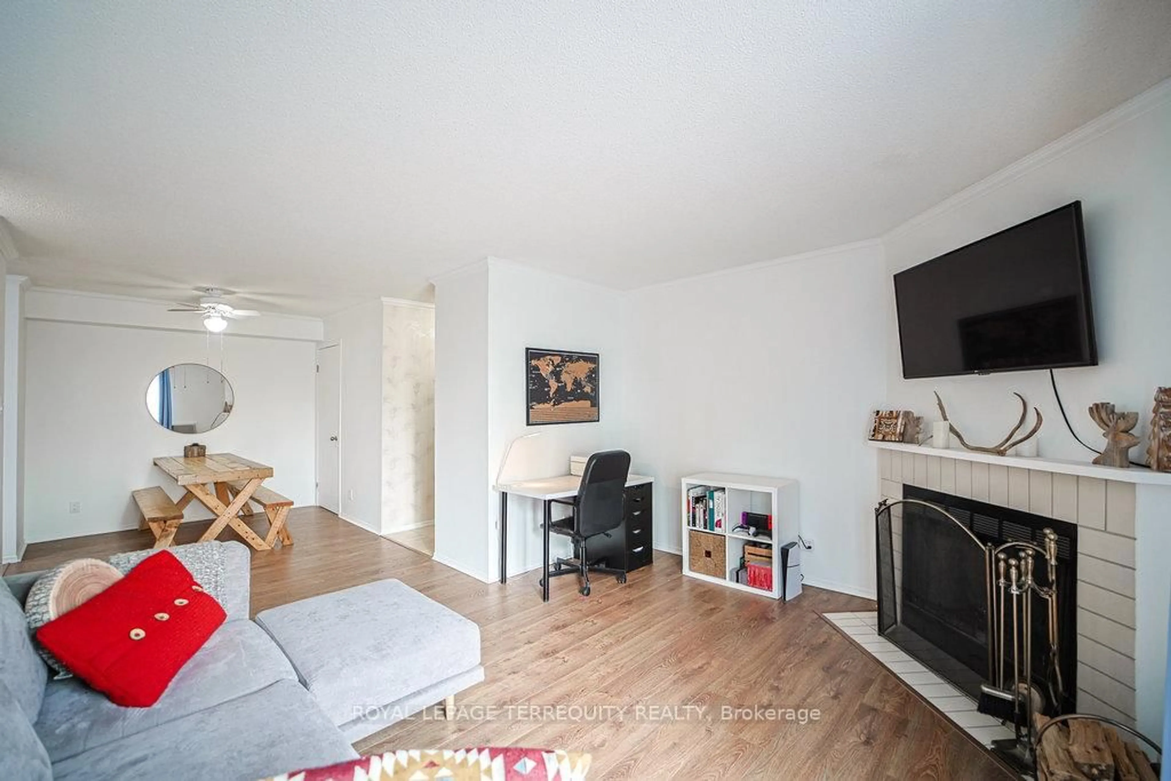 Living room with furniture, wood/laminate floor for 95 Trailwood Dr #832, Mississauga Ontario L4Z 3L2